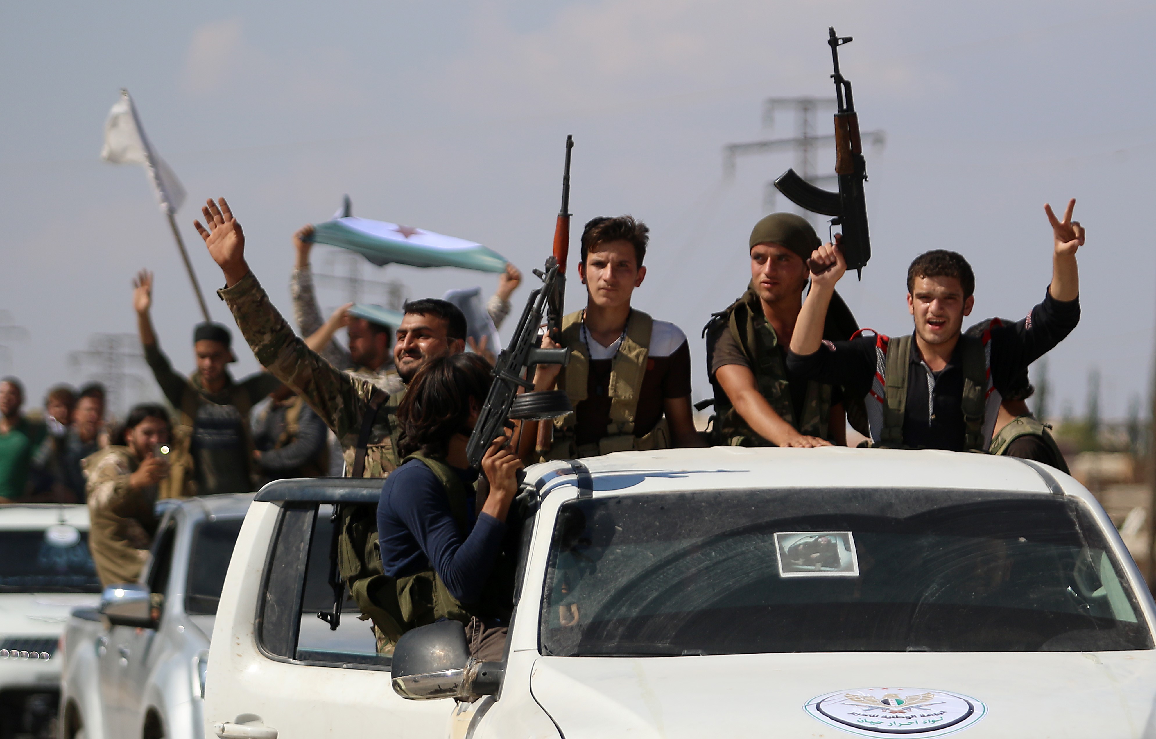  Syrian rebel fighters from the recently-formed 