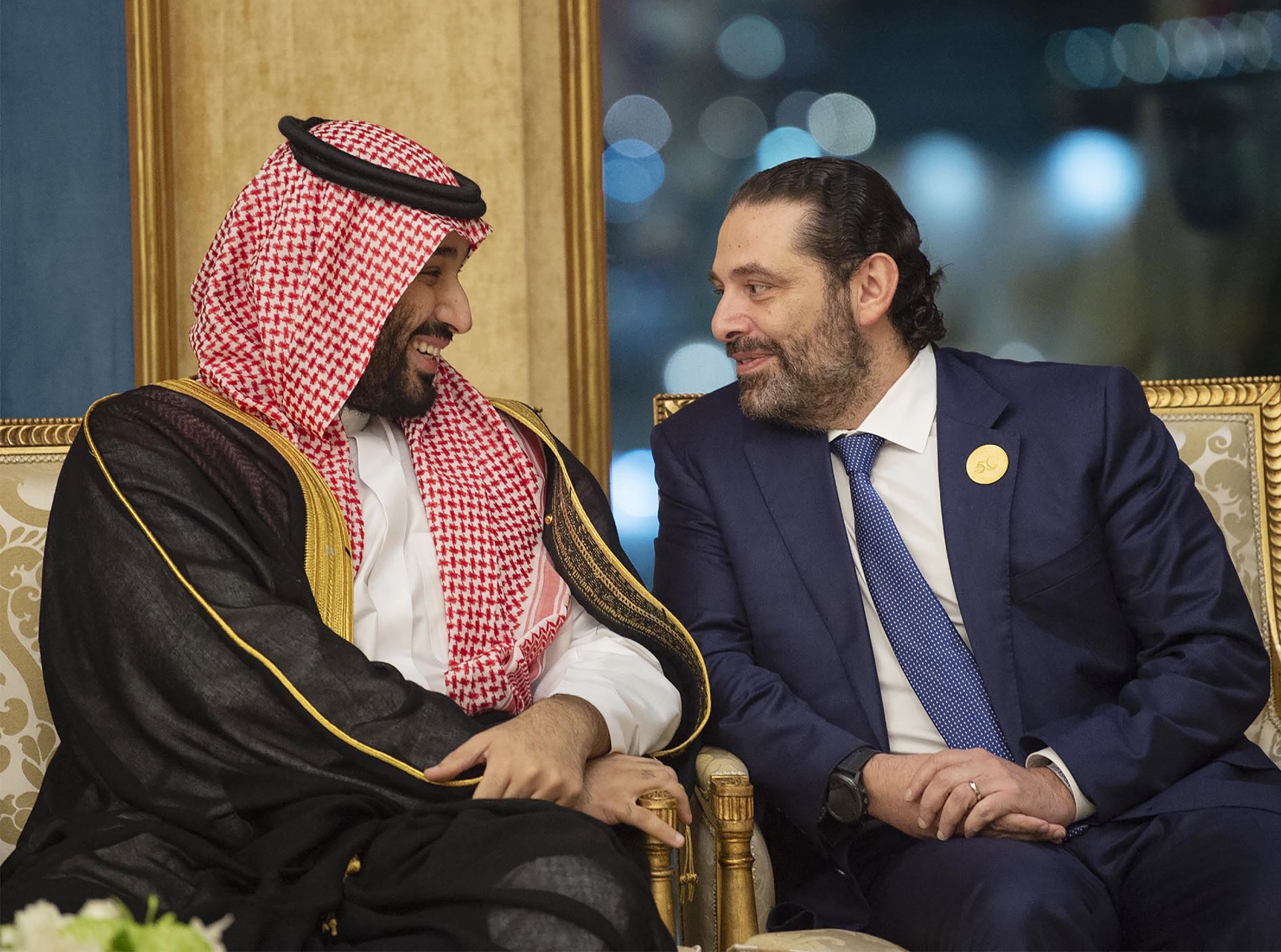 Crown Prince Mohammed bin Salman chatting with Saad Hariri a year after the Lebanese prime minister was reportedly detained in Riyadh (AFP)