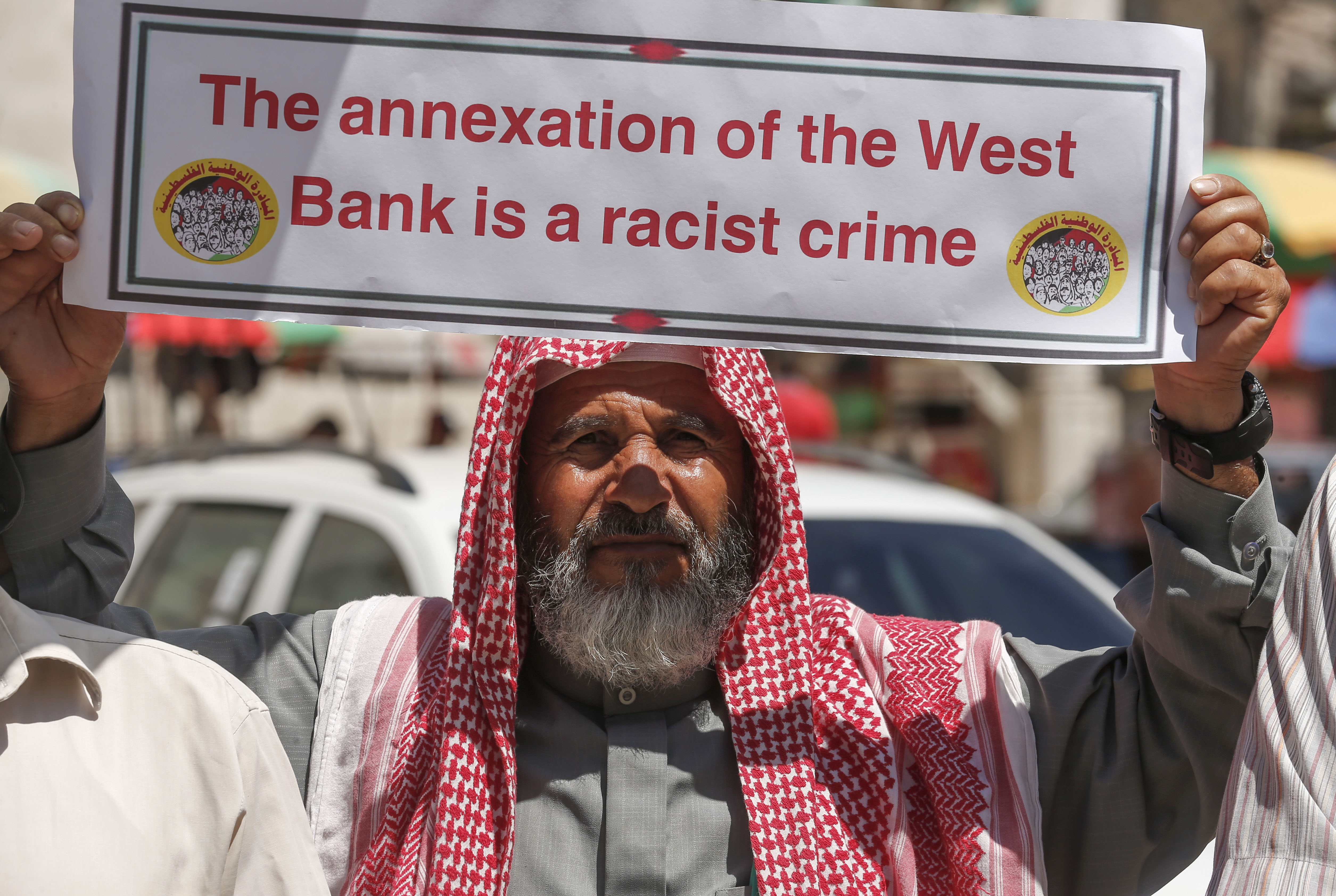 Palestinian protesters shout slogans as they take part in a demonstration against Israel's plans to annex parts of the occupied West Bank, in Khan Yunis in the southern Gaza Strip on June 23, 2020. 