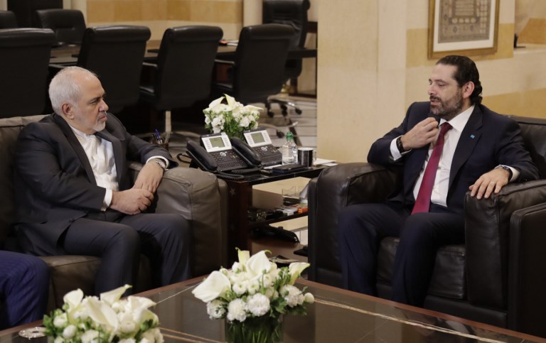 Iranian Foreign Minister Mohammad Javad Zarif meets Lebanese Prime Minister Saad Hariri in Beirut on 11 February (AFP)
