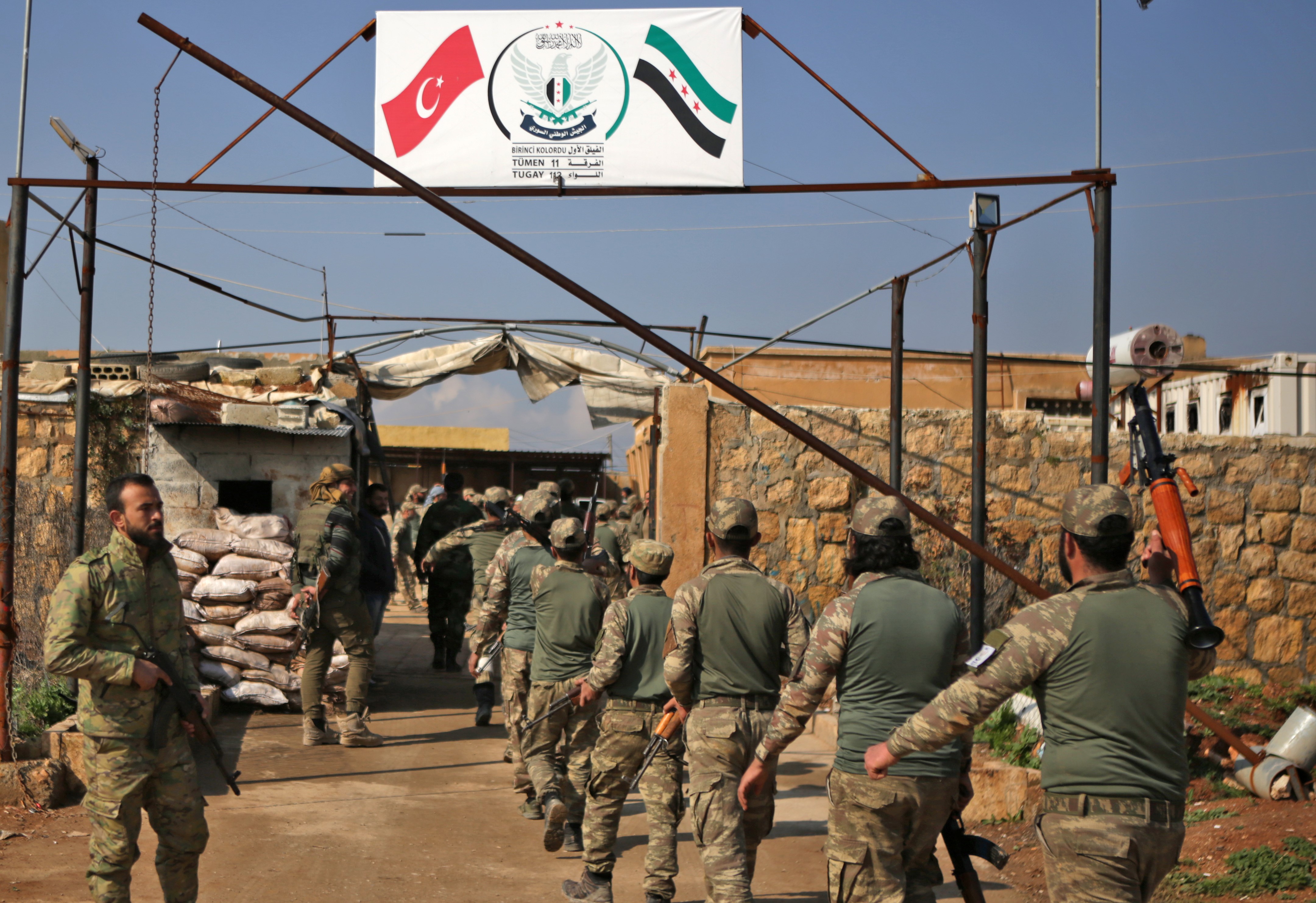  Turkish-backed fighters take part in a training at a military barracks, north of the Syrian town of Manbij on 6 March (AFP)