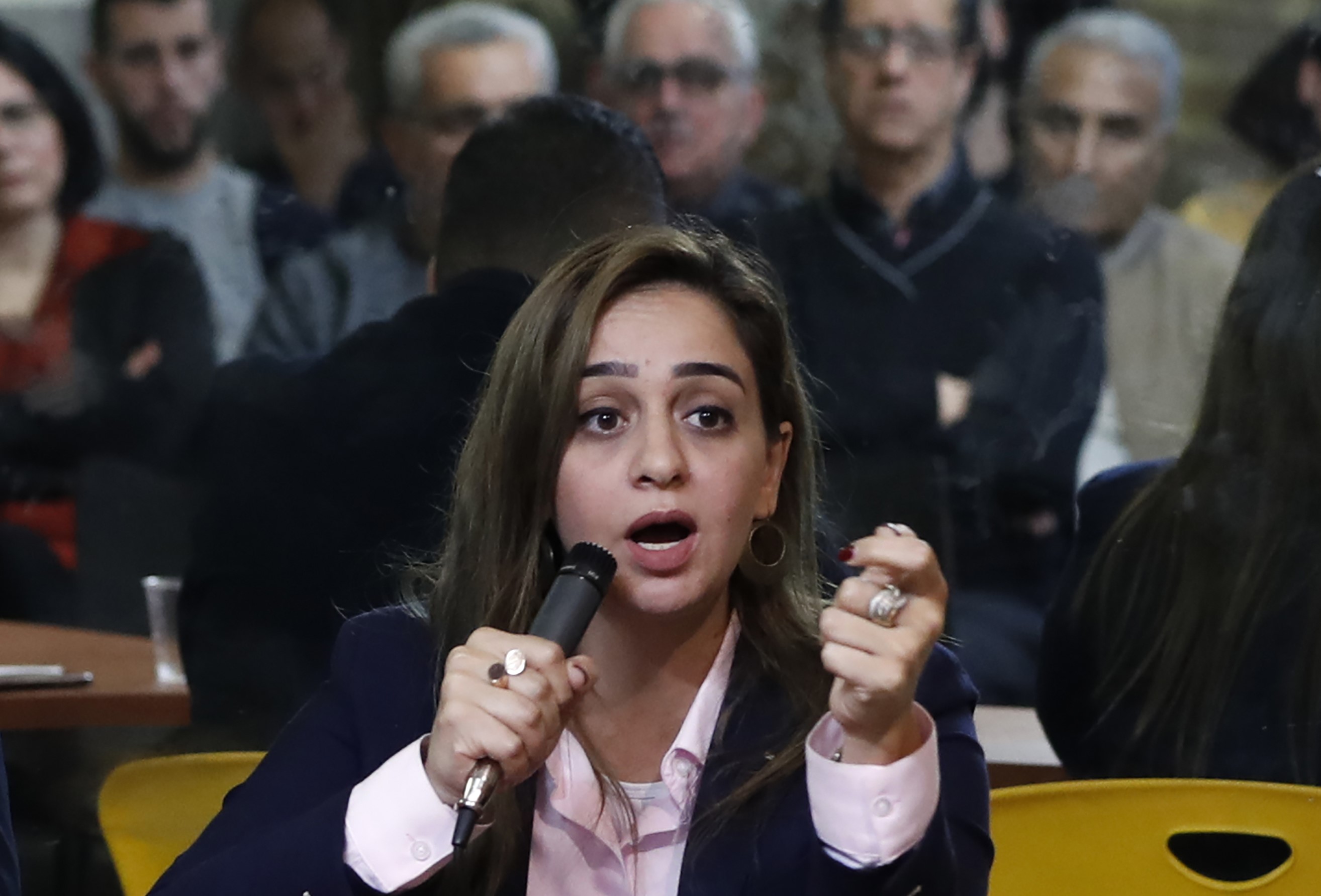 Arab Israeli Sondos Saleh, a candidate for the Hadash-Taal alliance of Arab parties, speaks during a campaign meeting in the northern Israeli city of Acre on 26 March (AFP)