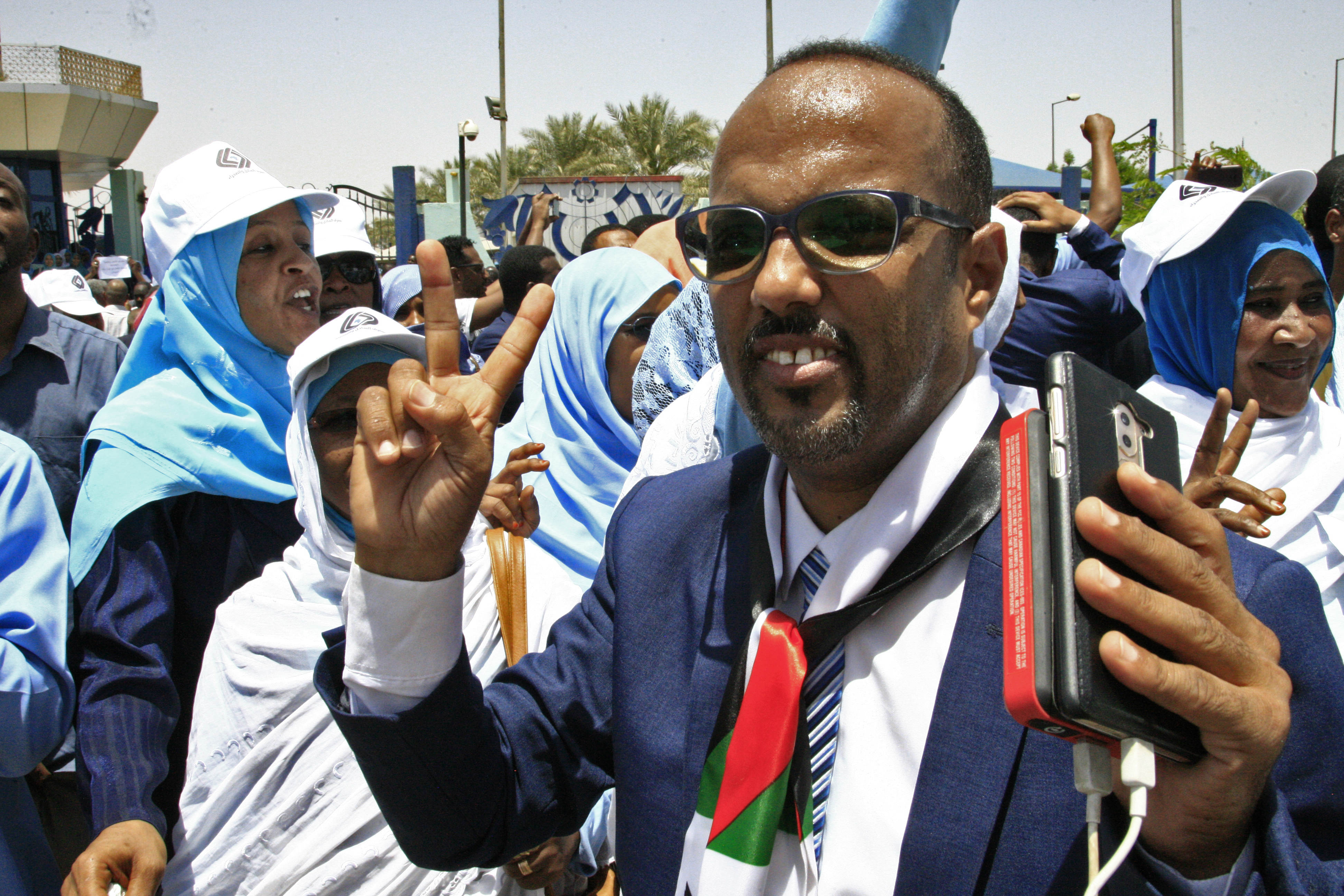 Sudanese protesters gather during a demonstration outside the Central Bank in Khartoum (AFP)