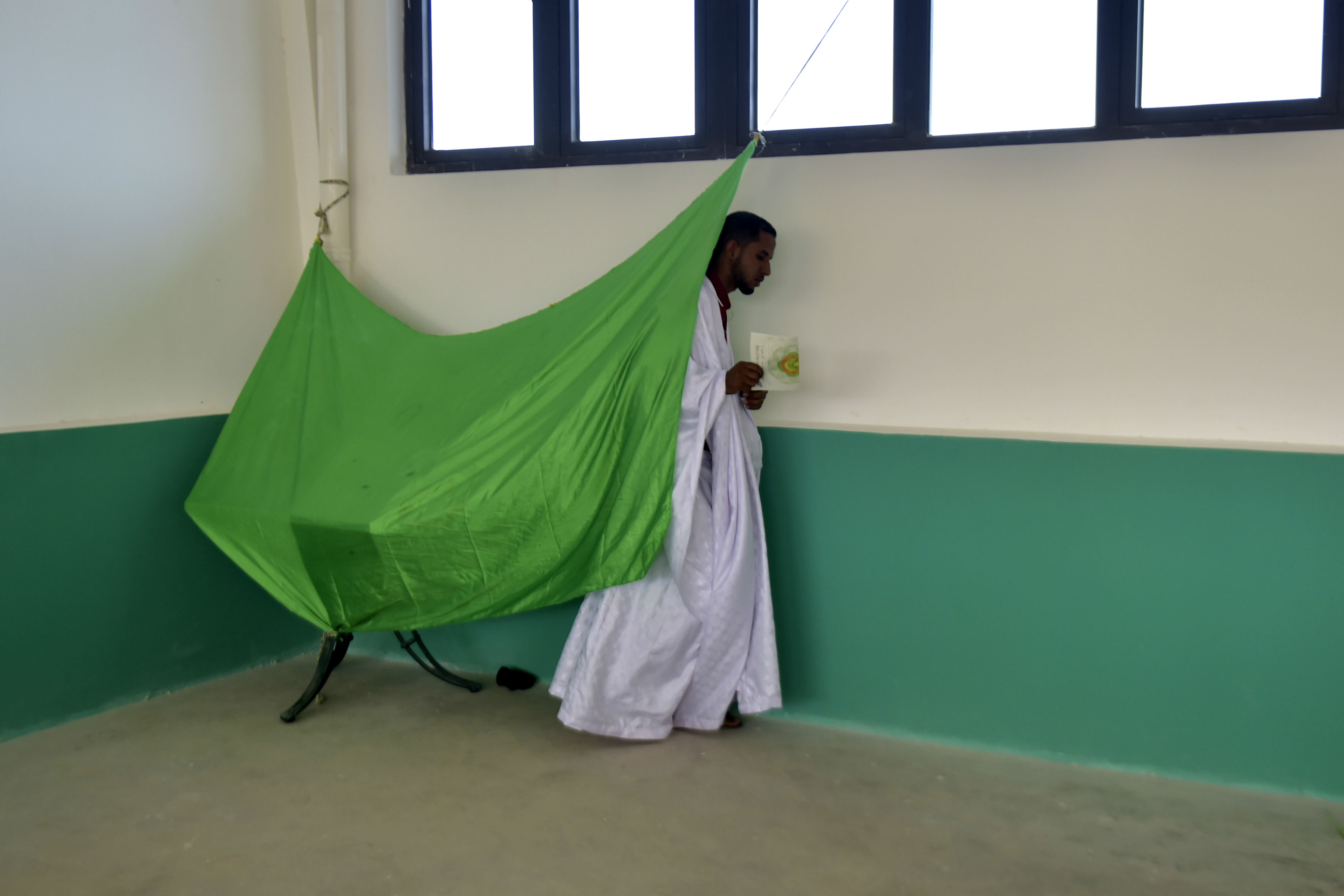 A man leaves a polling booth prior on 22 June 2019 at a polling station in Nouakchott during the presidential election in Mauritania (AFP)