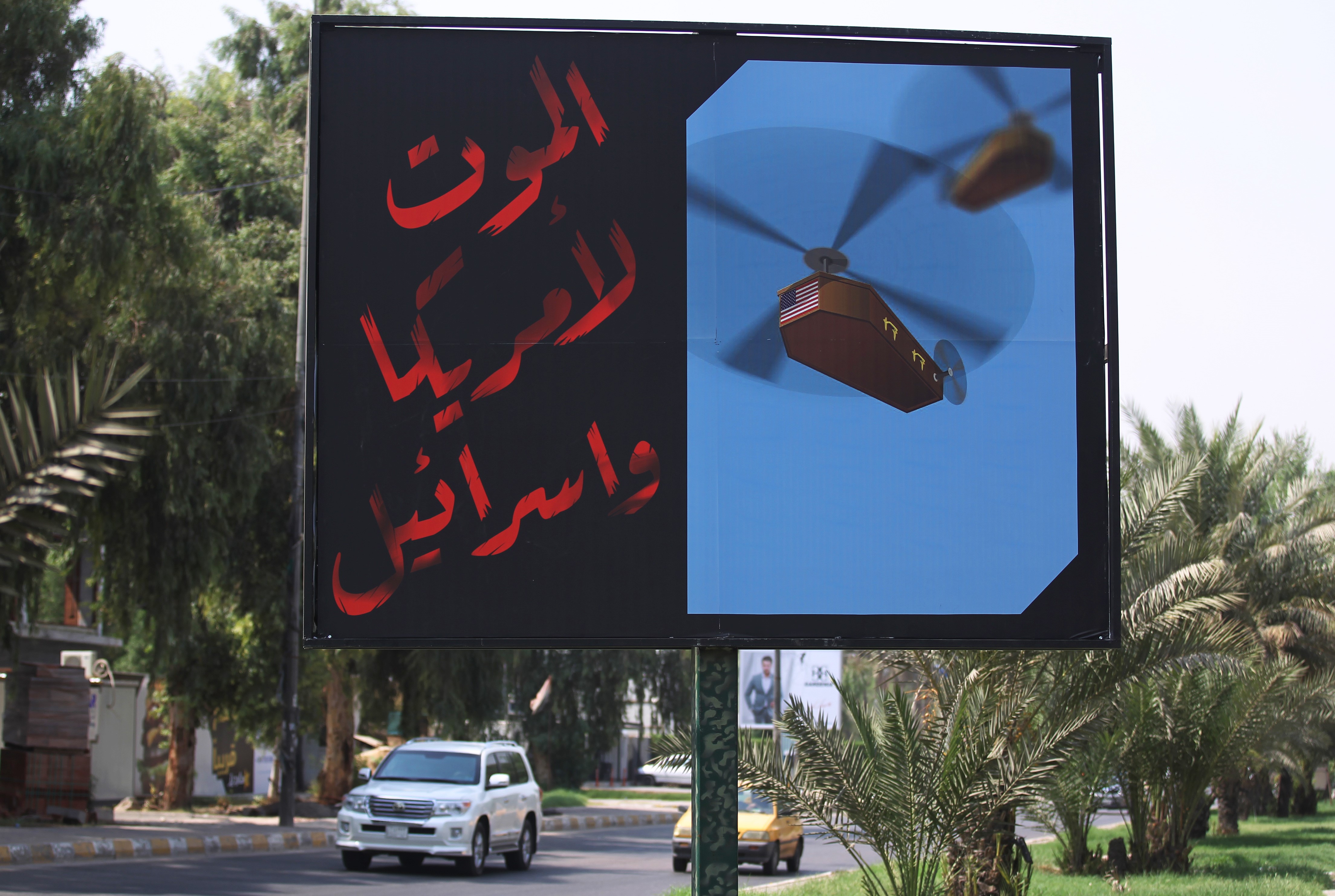 A billboard installed by members of Iraq's Hashed al-Shaabi on a main road in Baghdad with the slogan: 