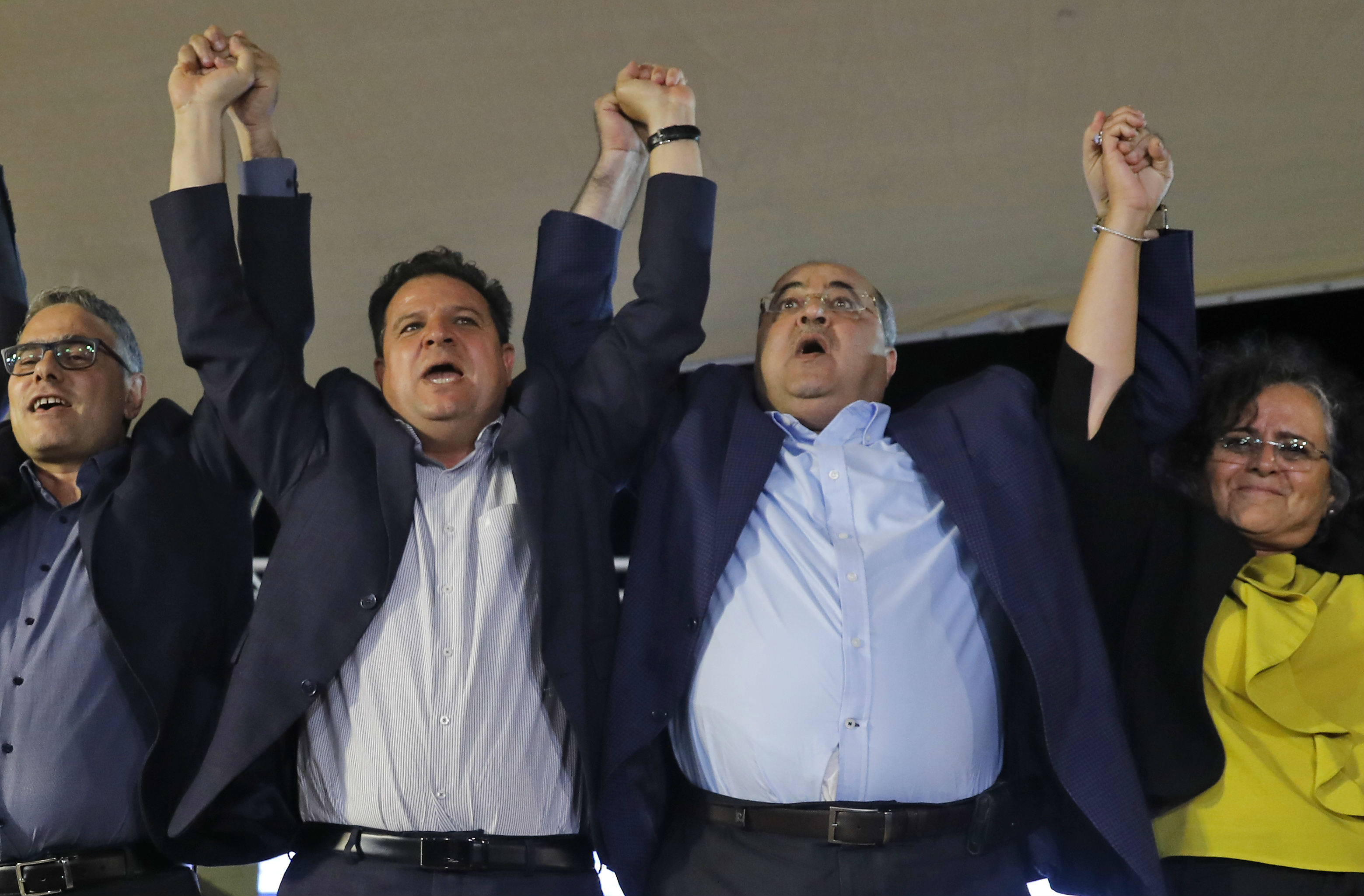 Joint List candidates Mtanes Shehadeh, Ayman Odeh, Ahmad Tibi and Aida Touma celebrate in Nazareth (AFP)