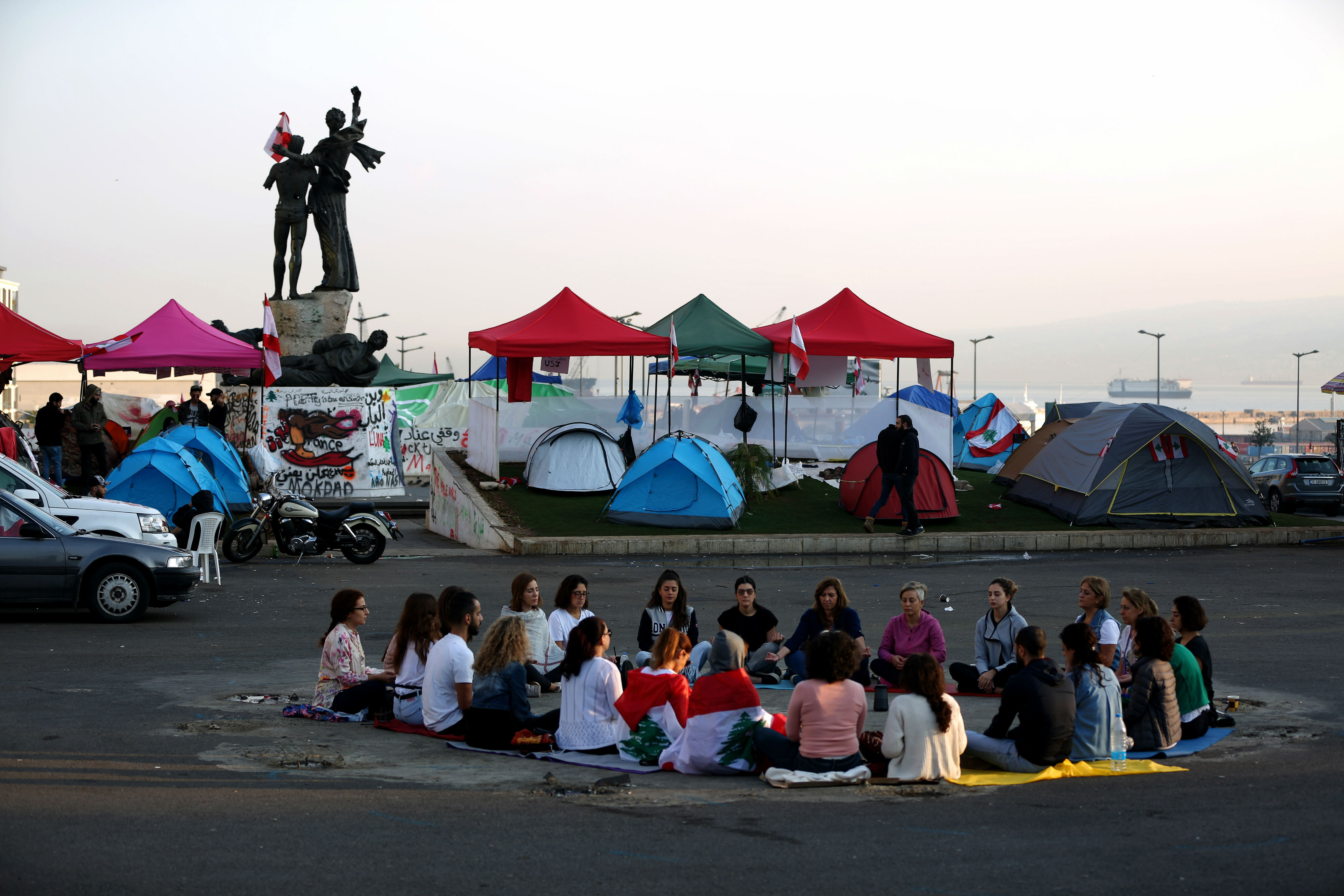 Lebanese protesters practice meditation in Beirut's Martyrs Square (AFP)