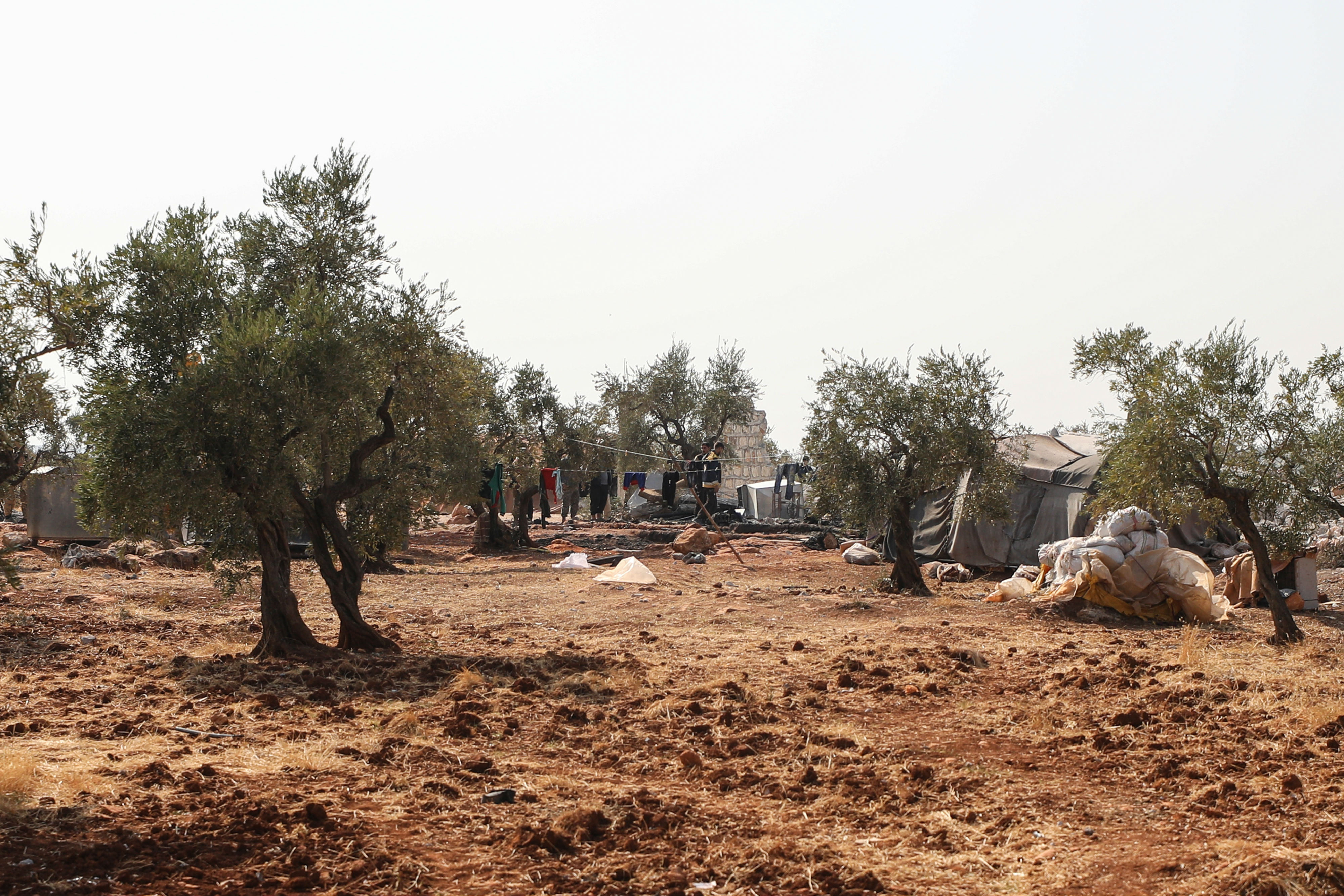 Tents of displaced Syrians next to the site of the US raid (AFP)