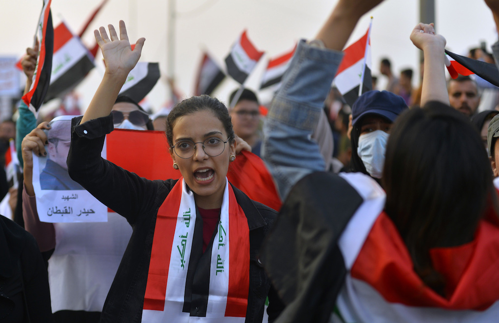 Supporters of the Iraqi Communist Party take part in a rally marking Labour Day in the capital Baghdad (AFP)