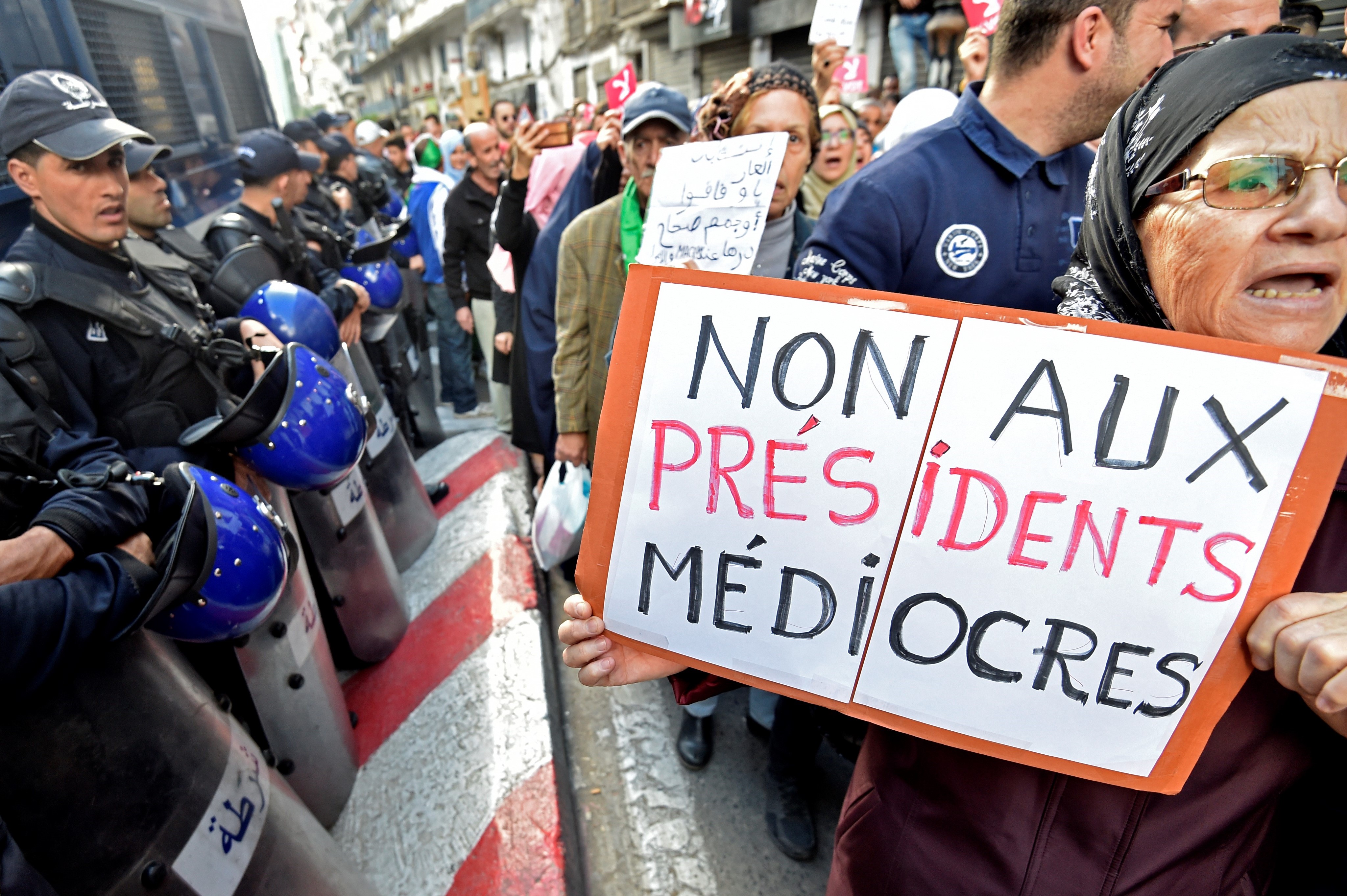  Algerian protesters take part in an anti-government demonstration in the capital Algiers on 10 December (AFP)