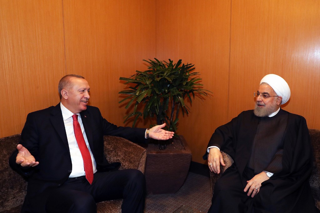 Turkish President Recep Tayyip Erdogan and Iranian President Hassan Rouhani speak at the conference in Kuala Lumpur last month (AFP)