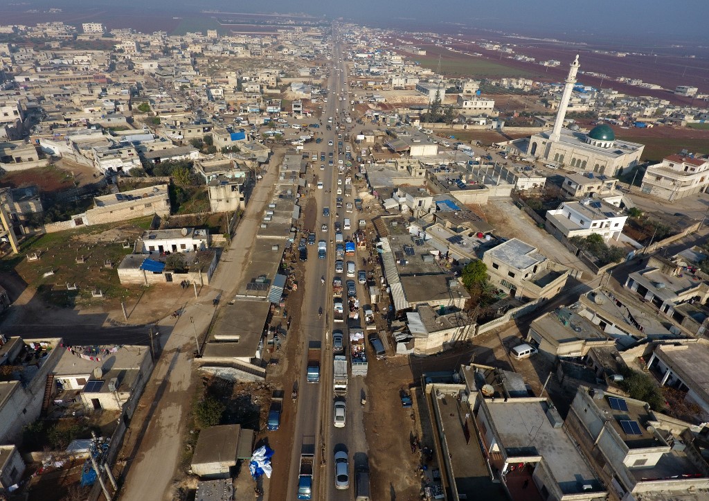 Thousands of Syrian civilians have fled north of Idlib towards the closed Turkish border (AFP)