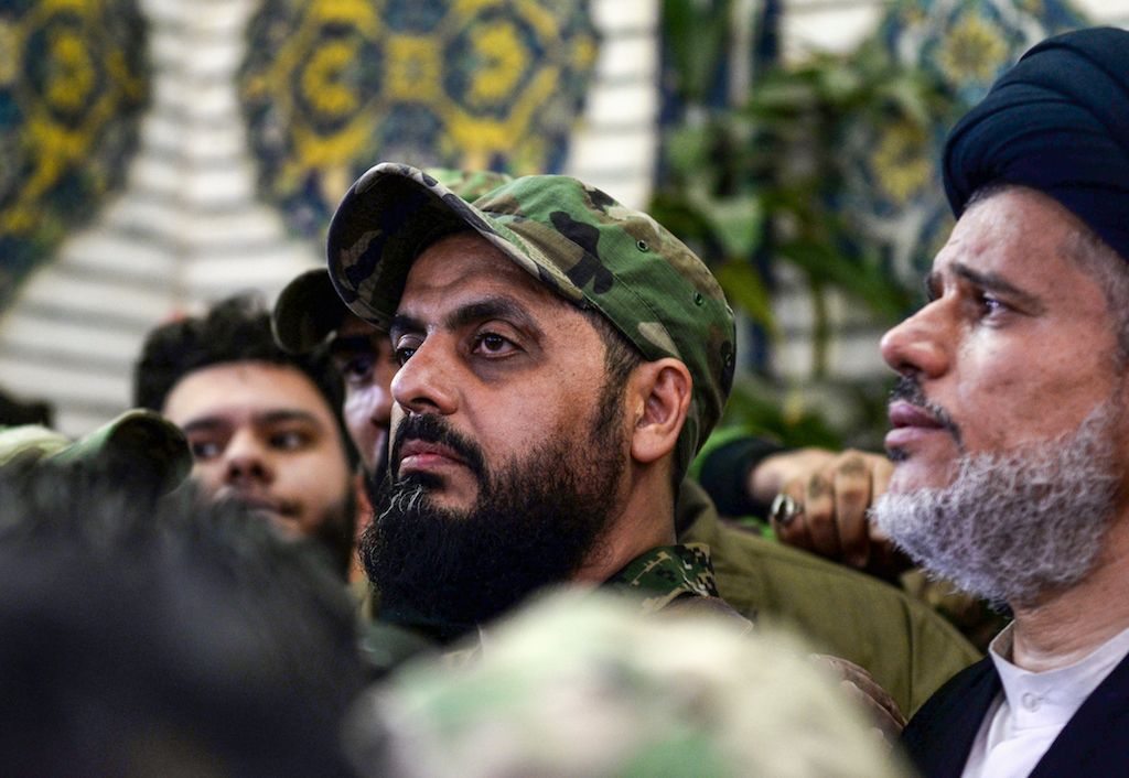 Qais al-Khazali (C) commander of the Asaib Ahl al-Haq pro-Iran faction attends the funeral procession of slain Iraqi paramilitary chief Abu Mahdi al-Muhandis (AFP)