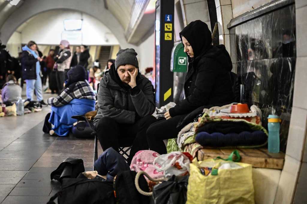 A couple in an underground metro station 