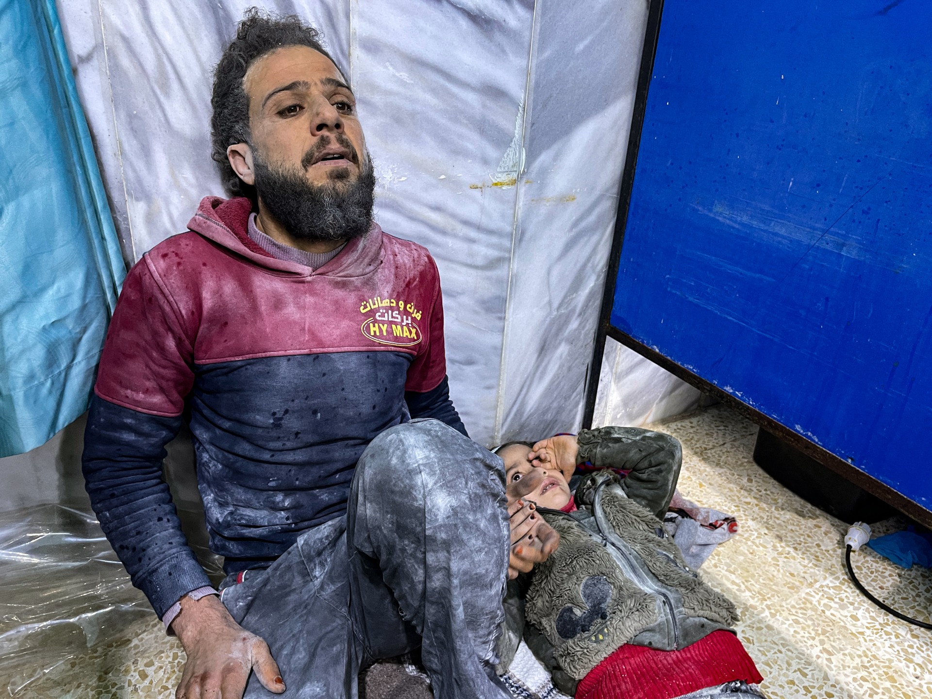 An injured child awaits treatment at the emergency ward of the Bab al-Hawa hospital following an earthquake, in the rebel-held northern countryside of Syria's Idlib province (AFP)