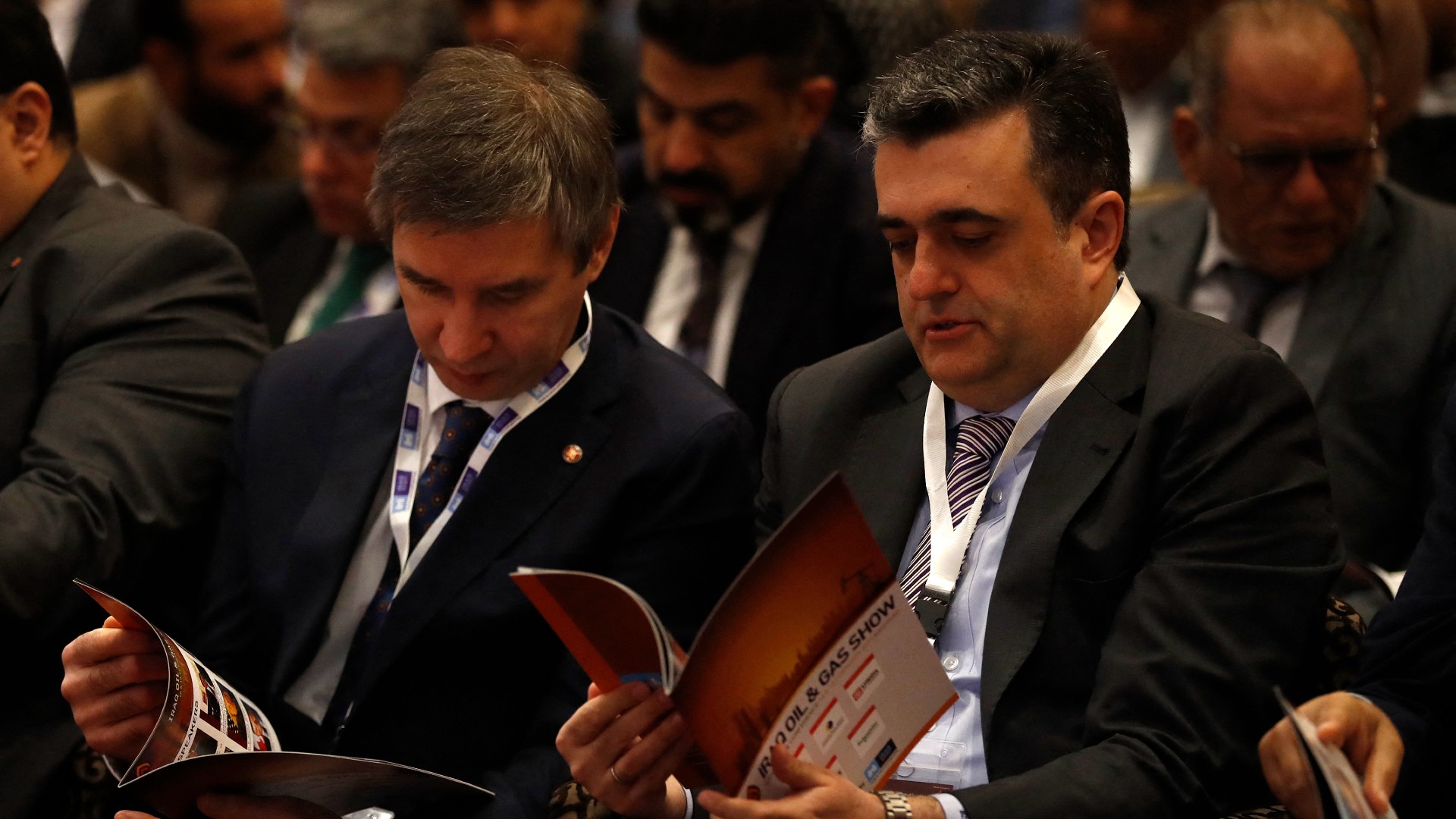 Representatives for Russia's oil producer Lukoil attend the Iraq Oil and Gas Show conference at in Baghdad on 18 February (AFP)