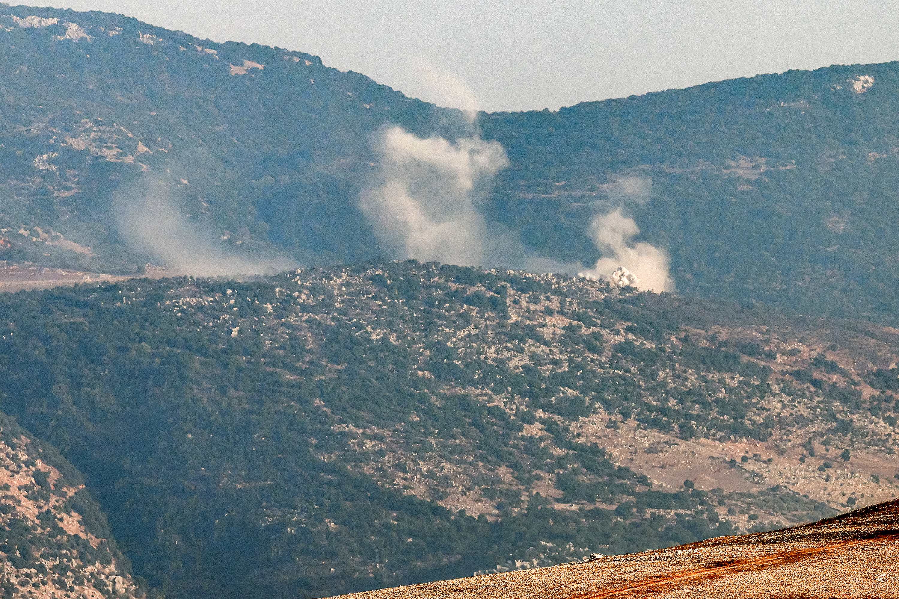 This picture taken from Lebanese town of Marjayoun shows smoke billowing in the contested border area of Shebaa farms on 14 October (AFP)