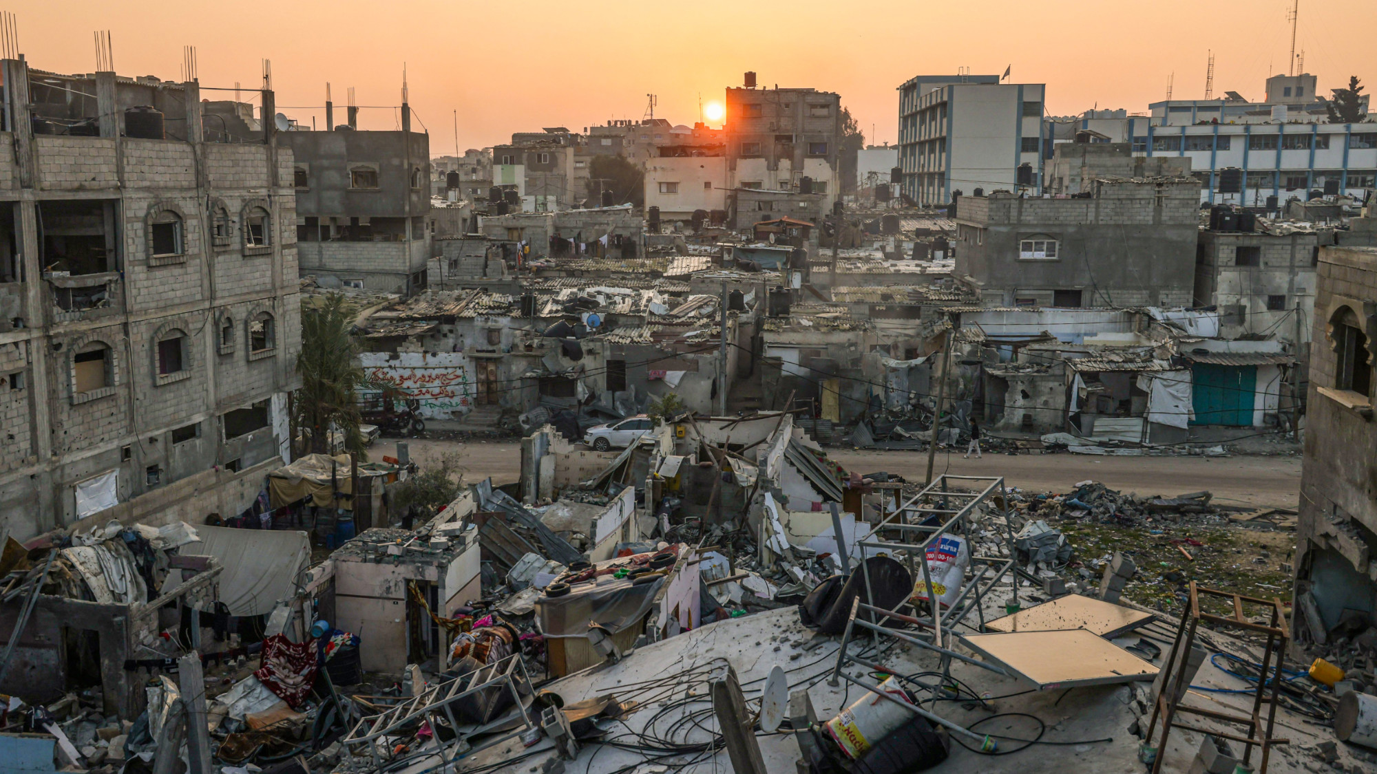 The sun rises above the Rafah refugee camp in the southern Gaza Strip on 1 January 2024 (AFP)