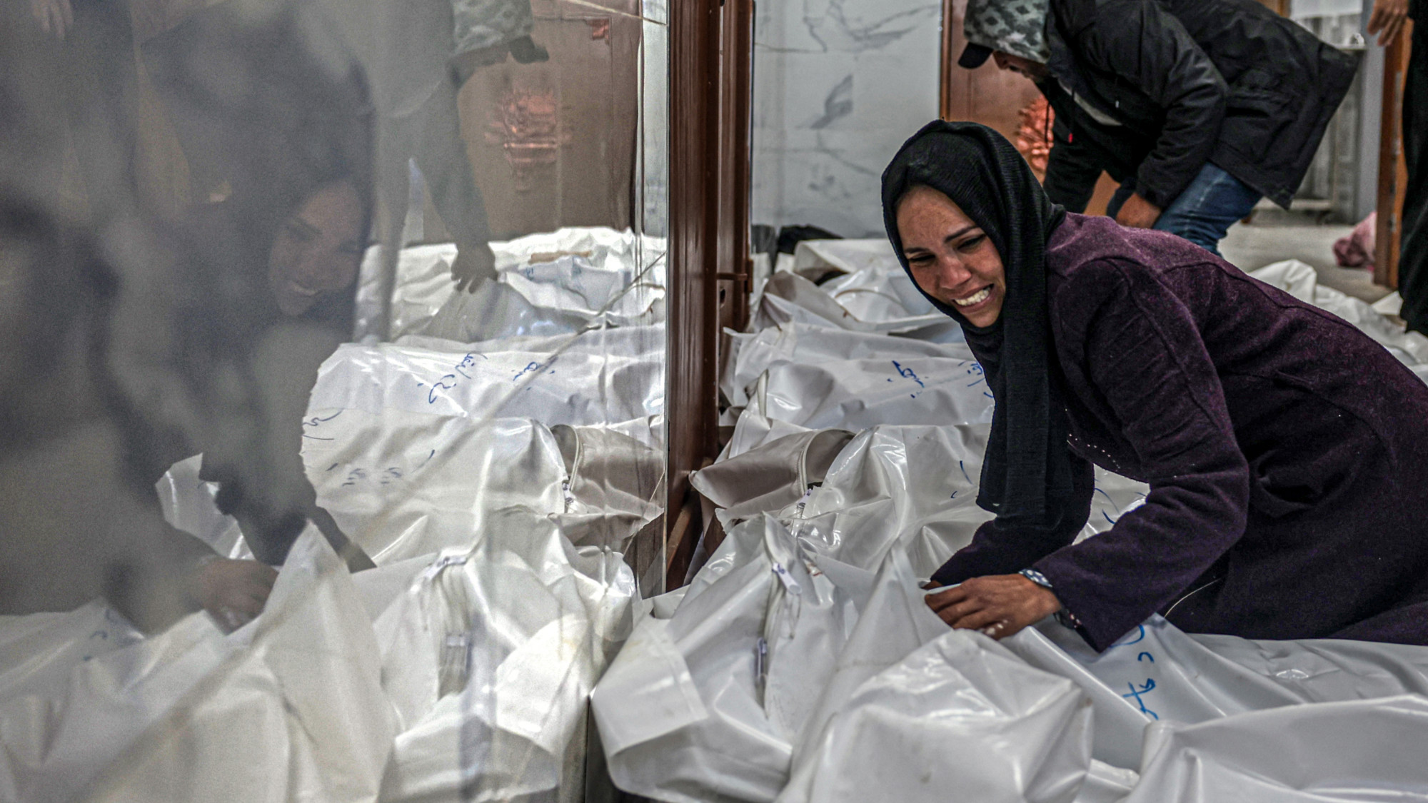 A relative of Palestinians killed when the al-Faqawi family home was hit during overnight Israeli bombardment in Khan Younis on 5 March 2024 (Said Khatib/AFP)