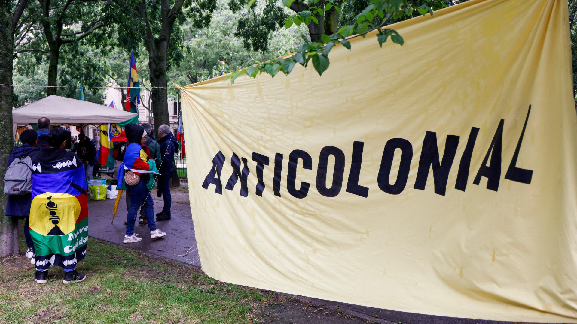 Protestors in Paris demonstrate in support of the Kanak people on 14 May 2024, during a debate over a voting reform bill for New Caledonia that would go on to pass in July 2025, despite widespread opposition and unrest (Ludovic Marin/AFP)