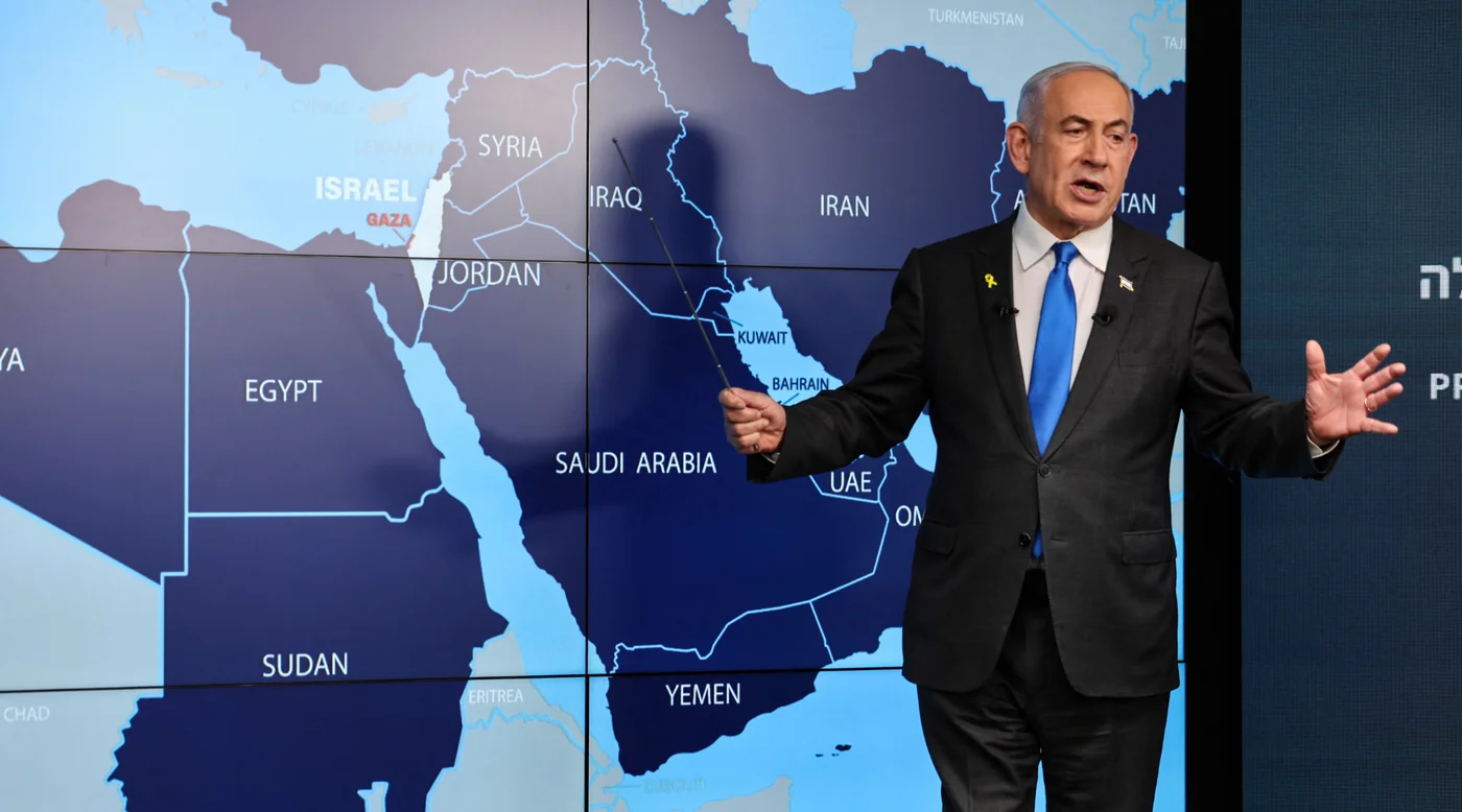 Israel's Prime Minister Benjamin Netanyahu speaks in front of a map of the Middle East during a press conference at the Government Press Office (GPO) in Jerusalem on 4 September 2024 (AFP/Abir Sultan)