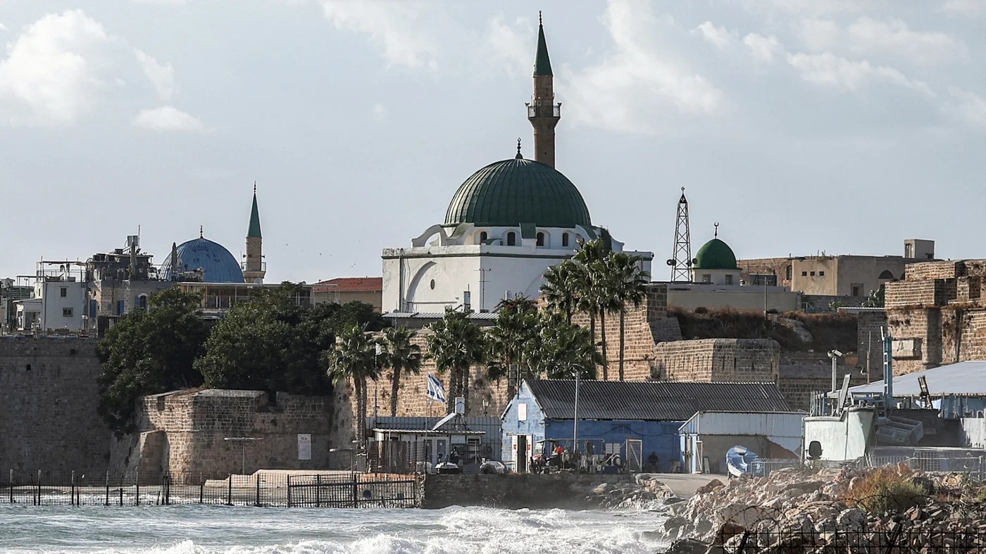 The 18th-century Ottoman-period al-Jazzar Mosque, also known as the 'White Mosque', is pictured in the old walled town of Acre in northern Israel on 1 October 2024 (AFP/Ahmad Gharabli)