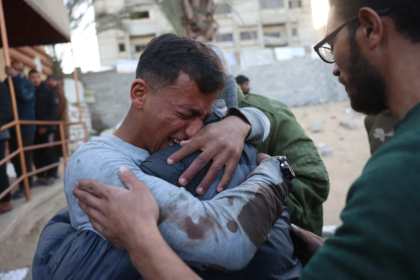 Palestinians mourn those killed in an Israeli strike at Khan Yunis' Nasser Hospital