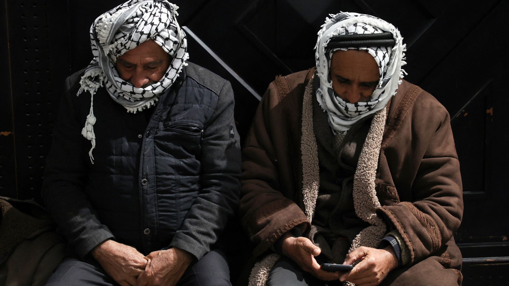 Palestinian families react after Israel delayed the release of Palestinian prisoners in the occupied West Bank city of Ramallah early on 23 February 2025 (AFP/Zain Jaafar)