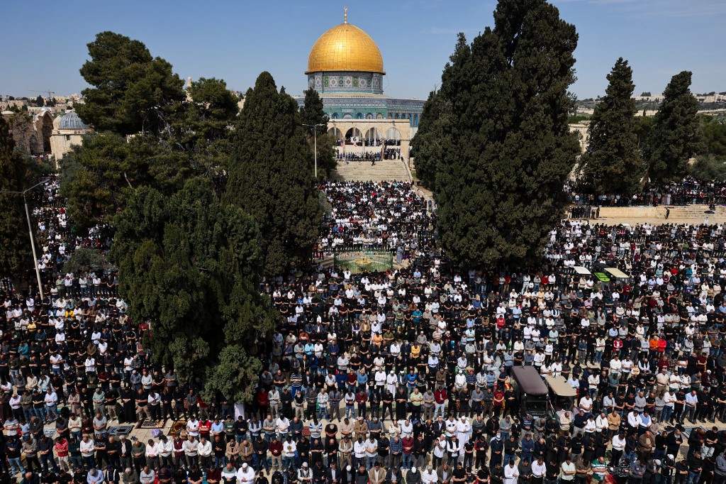 Muslim worshippers pray at the Al-Aqsa Mosque compound in Jerusalem on March 14, 2025, during the second Friday prayer of the holy month of Ramadan. (AFP)