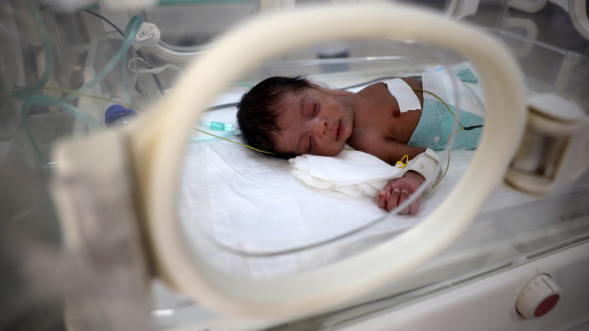 A prematurely born baby lies inside an infant incubator at the al-Aqsa Martyrs hospital in Deir el-Balah in the central Gaza Strip on 15 March 2025 (AFP) 