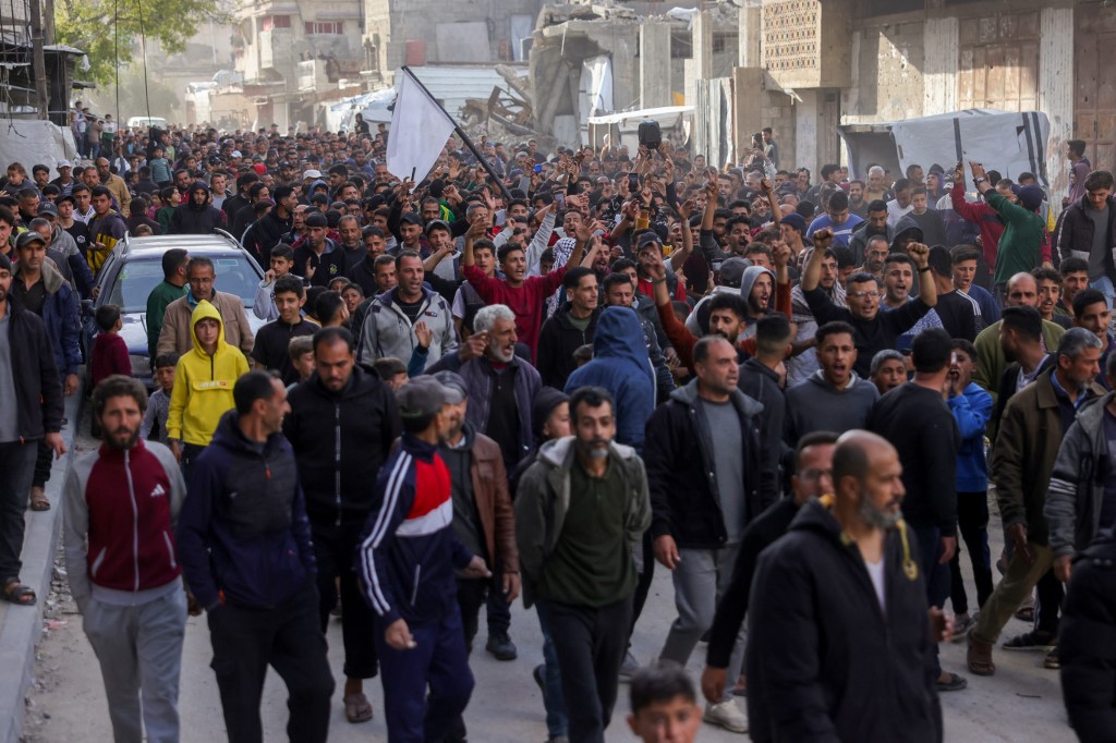 Palestinians attend a rally calling for an end to the war, in Beit Lahia, in the northern Gaza Strip, on March 25, 2025. (AFP)