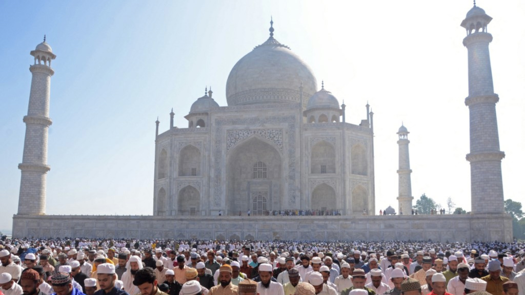 Muslims offer prayers during Eid al-Fitr, that marks the end of the Islamic holy fasting month of Ramadan, inside the complex of the Taj Mahal in Agra on March 31, 2025.