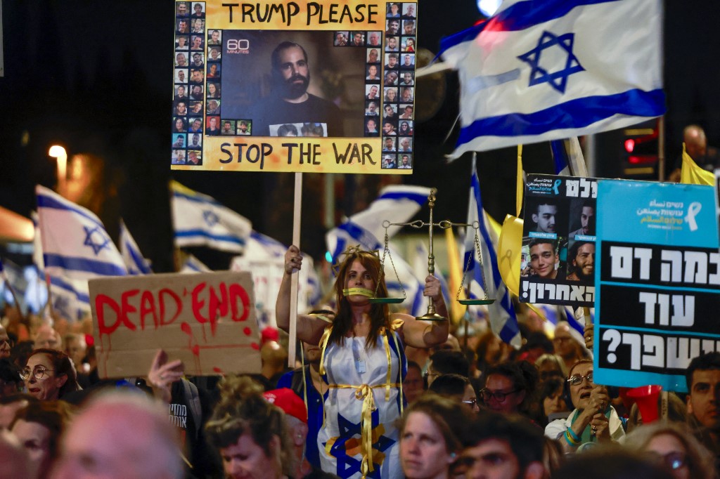 Israeli anti-government demonstrators take part in a protest calling for an end to the war and the return of all the captives in Gaza, outside the Israeli parliament in Jerusalem, on 31 March, 2025. (AFP)