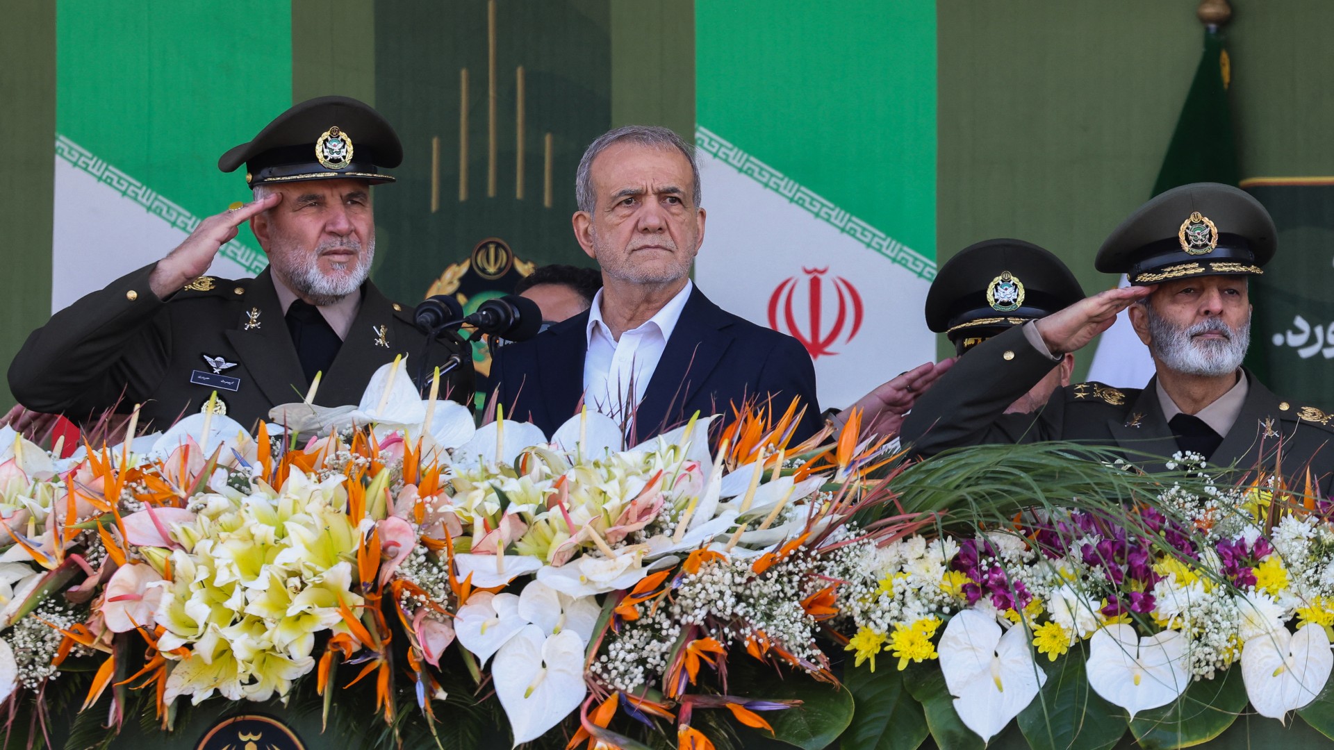 Iran's President Masoud Pezeshkian (C) watches a military parade during a ceremony marking the country's annual Army Day in Tehran on April 18, 2025. Atta KENARE / AFP