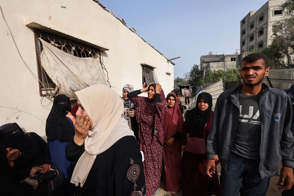 Relatives mourn the death of Palestinian eleven-year-old girl Rimas Obeid, who was killed in Israeli strikes on Al-Hasanat mosque at the Nuseirat refugee camp in the central Gaza Strip on May 12, 2025.