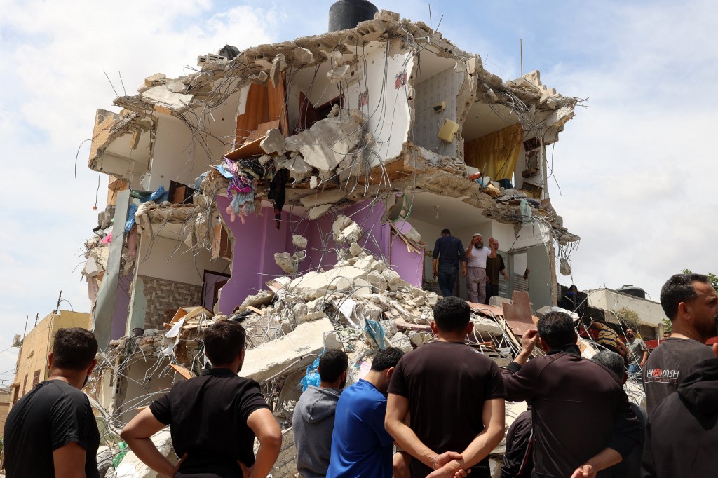 People check the devastation in a house after Israeli troops surrounded it and reportedly killed five people who were inside, during an army raid on Tammun in the occupied West Bank on May 15, 2025.