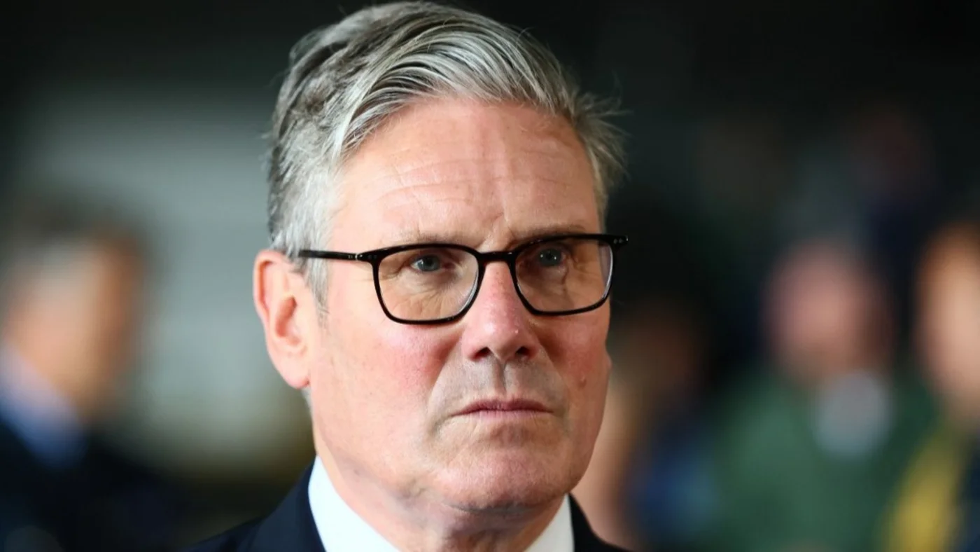 Britain's Prime Minister Keir Starmer speaks to members of the media during a visit to RAF Valley, in Anglesey, Wales, 27 June 2025 (AFP)