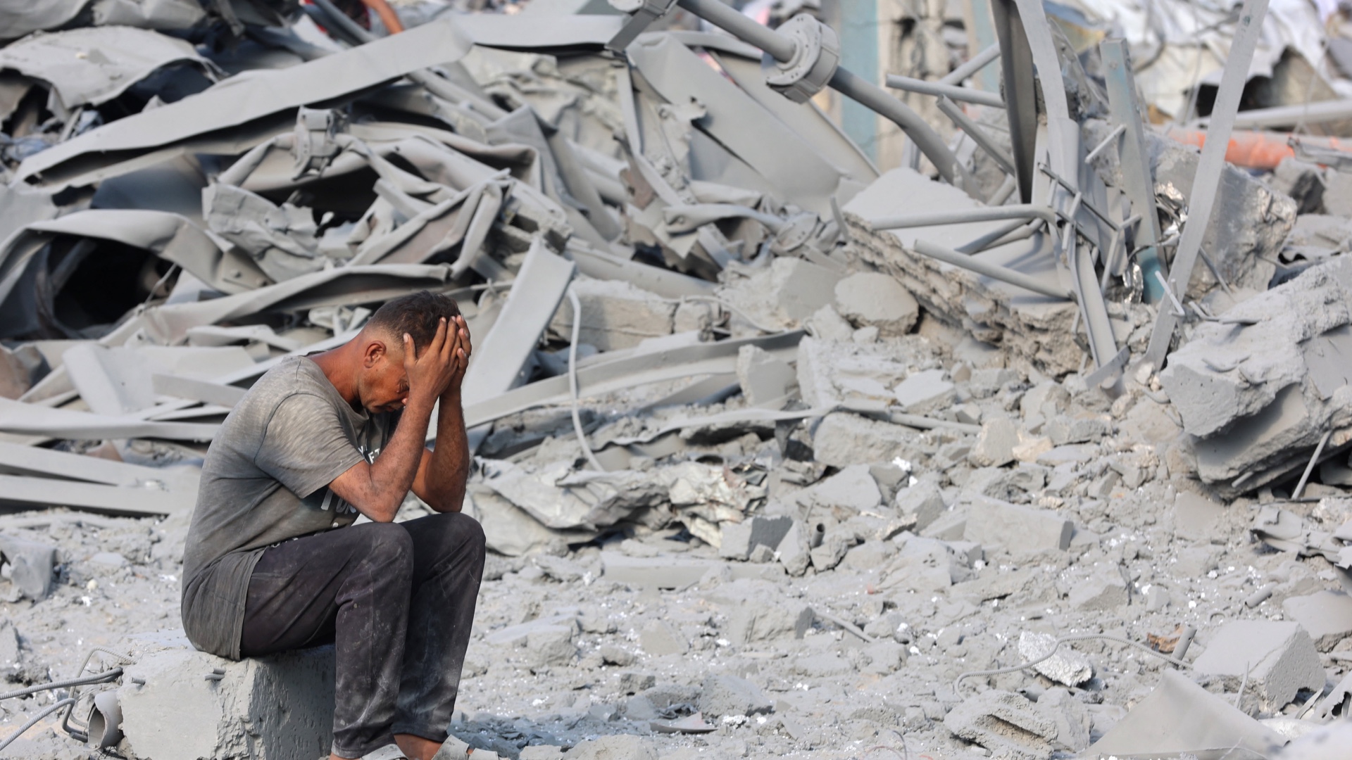 A Palestinian man surveys the damage after an Israeli strike on the UN-run Sheikh Radwan Health Centre in northern Gaza City on 6 August 2025, a day after Israeli attacks killed 68 people (Omar Al-Qattaa/AFP)