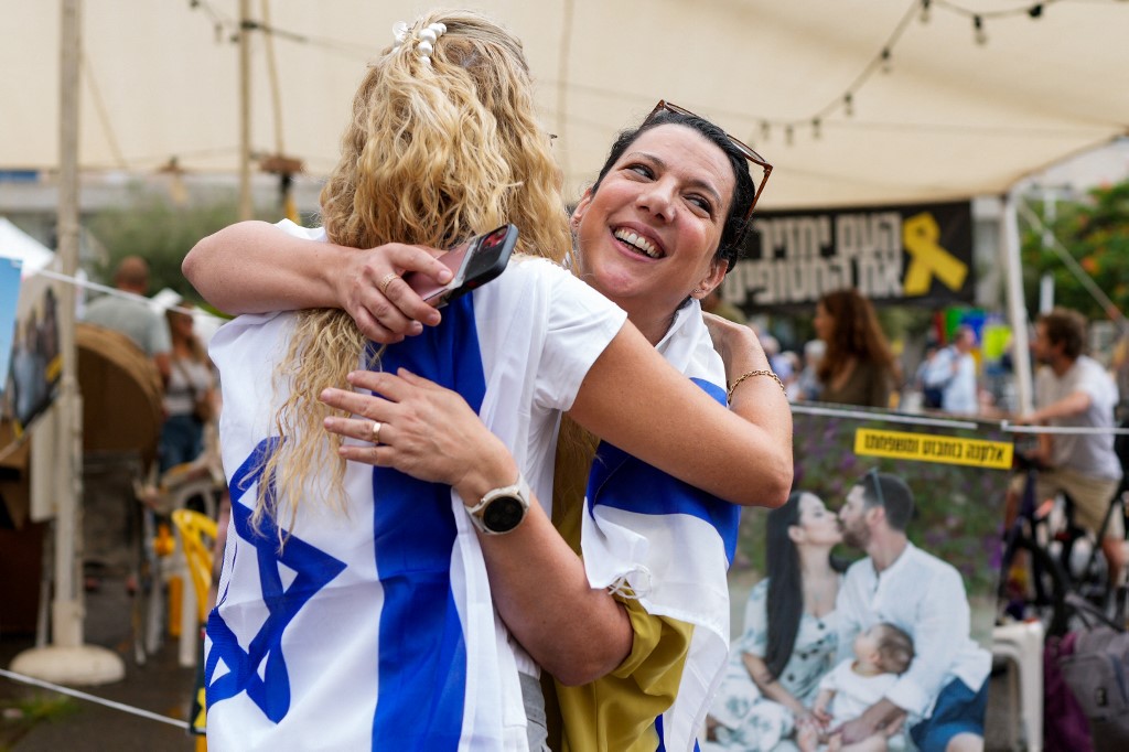 People react at Hostage Square in Tel Aviv on October 9, 2025,