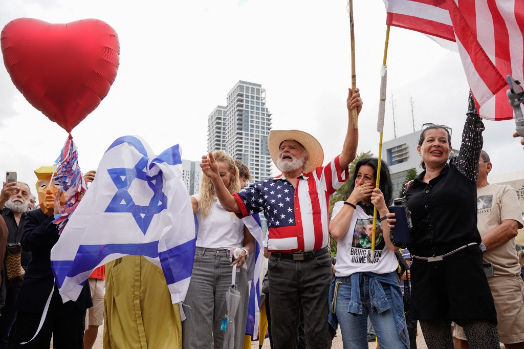 People react at Hostage Square in Tel Aviv on October 9, 2025, following news of a new Gaza ceasefire deal. Israel and Hamas on October 9 agreed a Gaza ceasefire deal to free the remaining living hostages, in a major step towards ending a war that has killed tens of thousands of people and unleashed a humanitarian catastrophe.