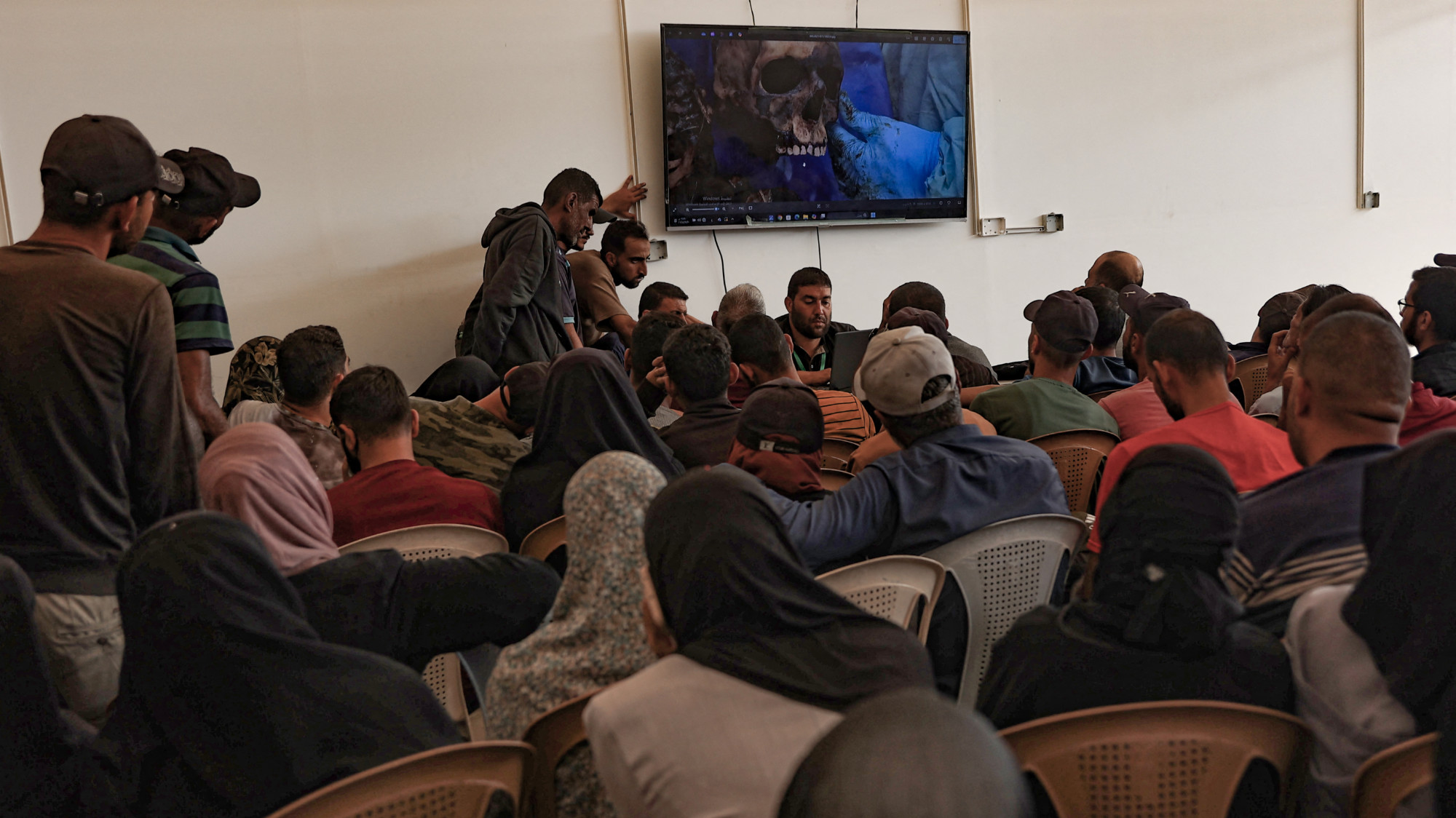 Details of Palestinian remains released by Israel are displayed to help families identify relatives at Nasser Hospital, Khan Yunis, 18 October 2025 (AFP/Omar al-Qattaa)