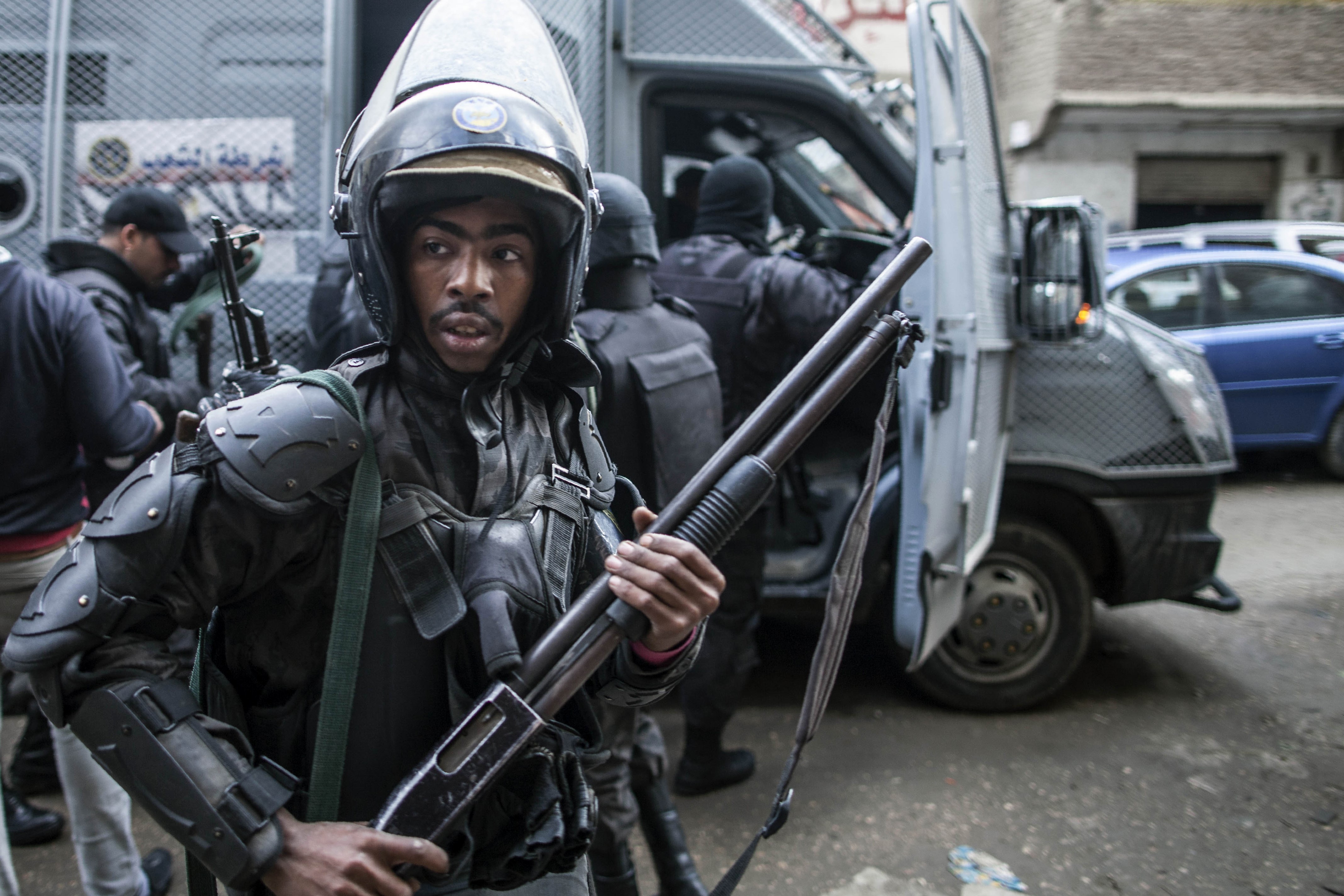 Members of the Egyptian police special forces patrol streets in al-Haram neighbourhood in the southern Cairo Giza district on 25 January, 2016 (AFP)