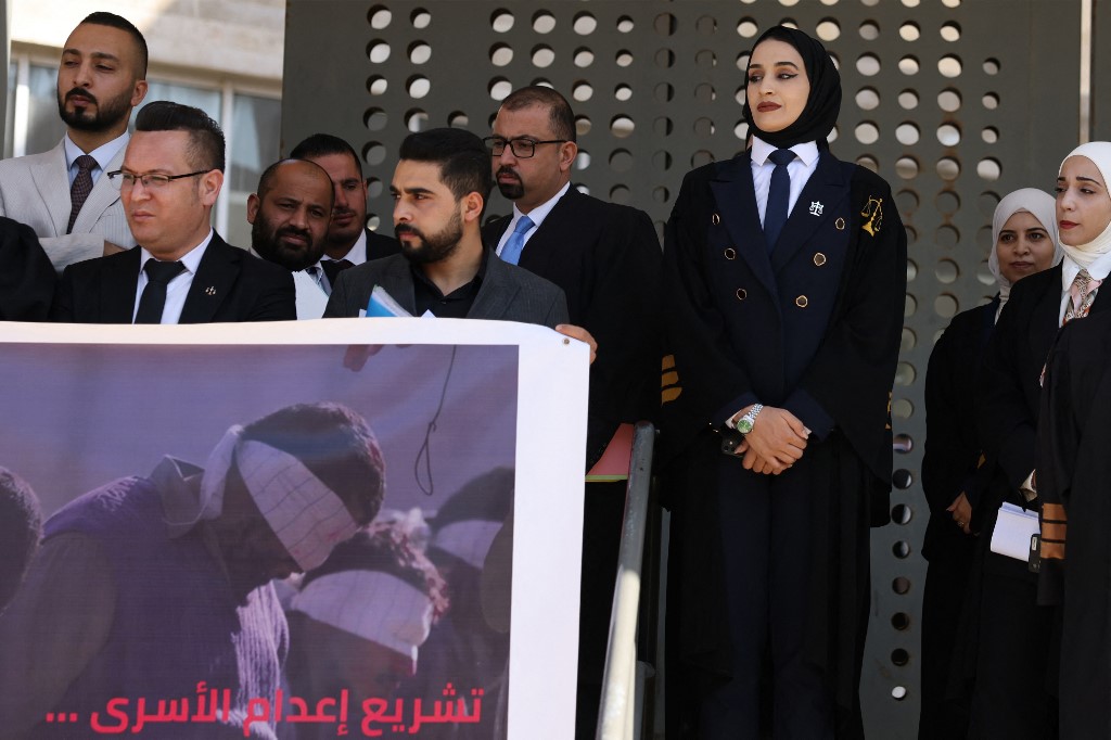 Palestinian lawyers protest against the proposed Israeli death penalty law in front of the Judicial Court, in the Israeli occupied West Bank city of Hebron on November 9, 2025. 