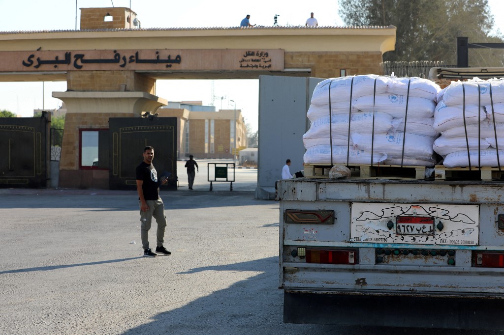 A truck loaded with humanitarian aid awaits permission on the Egyptian side of the Rafah crossing with the Gaza Strip, to drive toward the besieged Palestinians territory on July 27, 2025. 