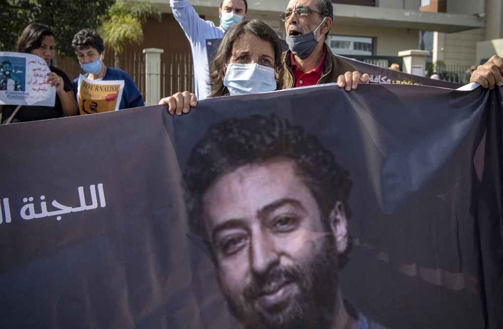 Journalist Omar Radi’s mother attends a protest in support of her son in Casablanca on 22 September 2020 (AFP)