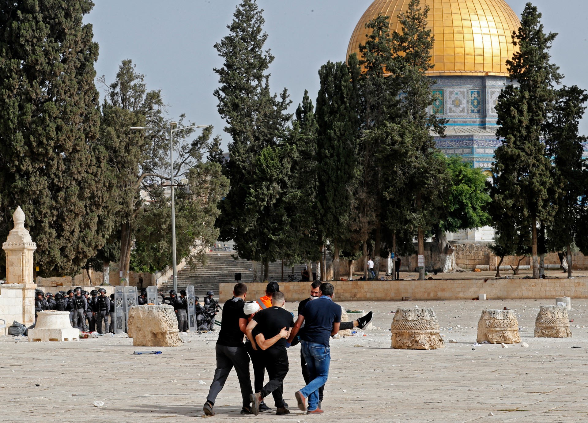 Palestinian medics evacuate a wounded protester (AFP)