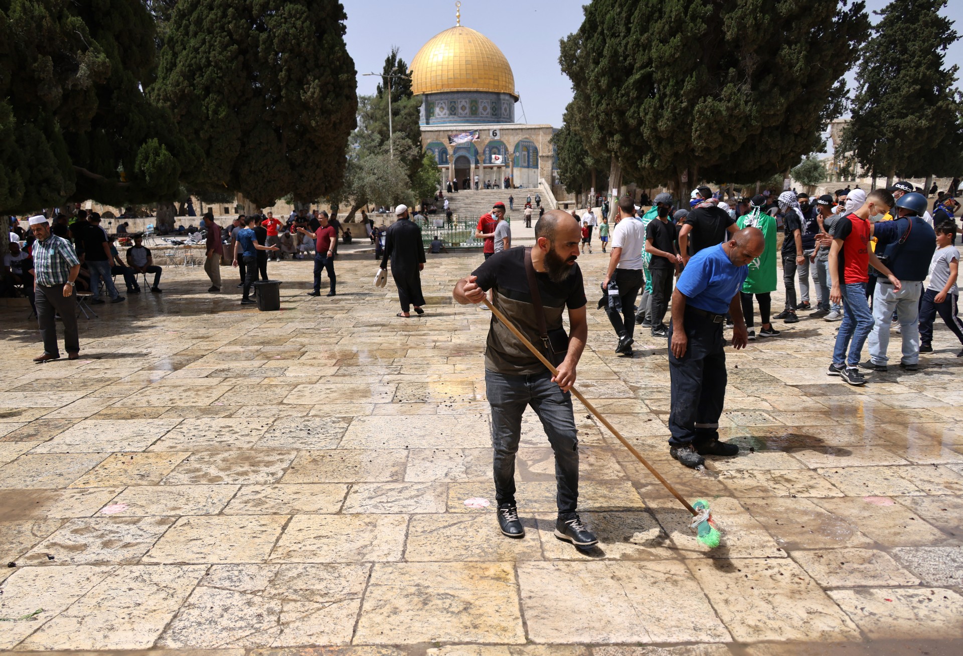 Palestinians clean at Jerusalem's al-Aqsa Mosque courtyard (AFP)