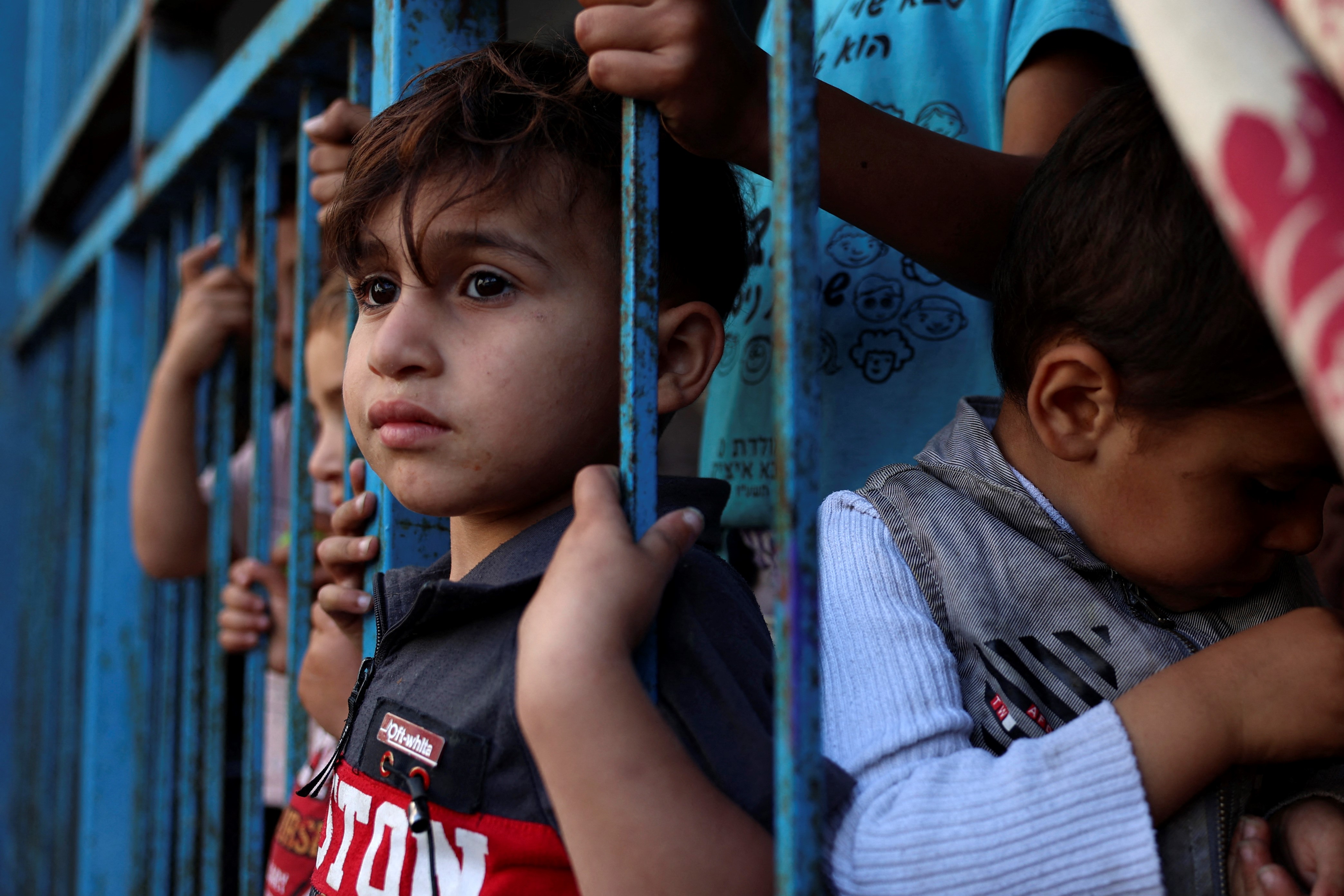 A Palestinian girl, who fled her home due to Israeli air and artillery strikes, plays at a school hosting refugees in Gaza city, on May 14, 2021,