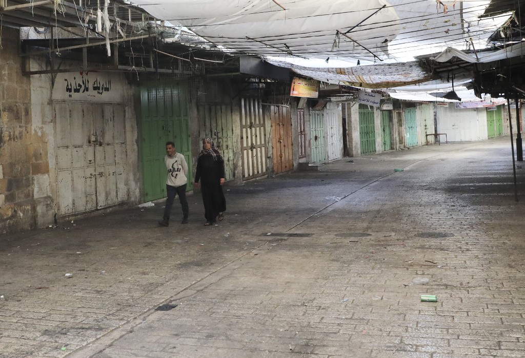 Palestinians from across the political spectrum began their nationwide general strike in protest to the escalating violence in Gaza and across historic Palestine (AFP)  