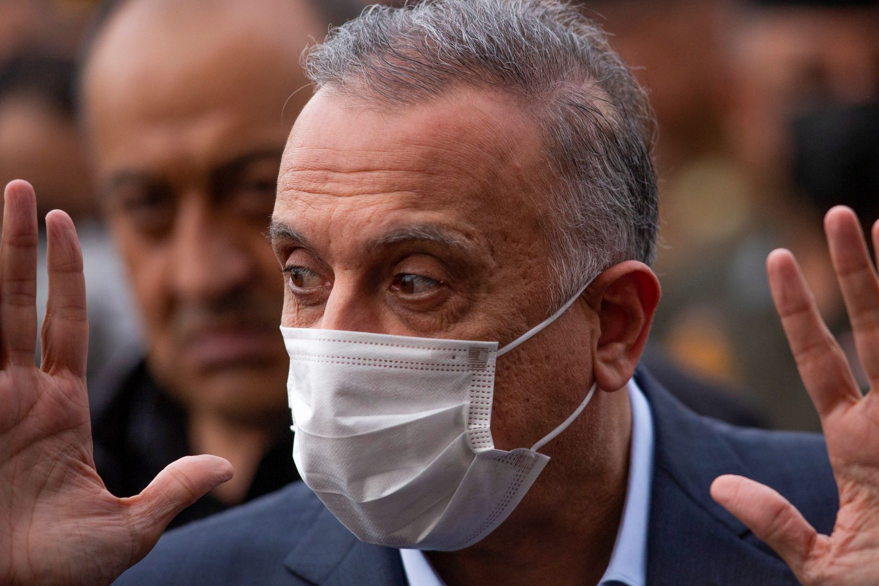 Iraq's Prime Minister Mustafa Kadhimi arrives to attend a memorial service for the victims of a motorcycle bomb that exploded the day before, in the southern city of Basra on December 8, 2021 (AFP)